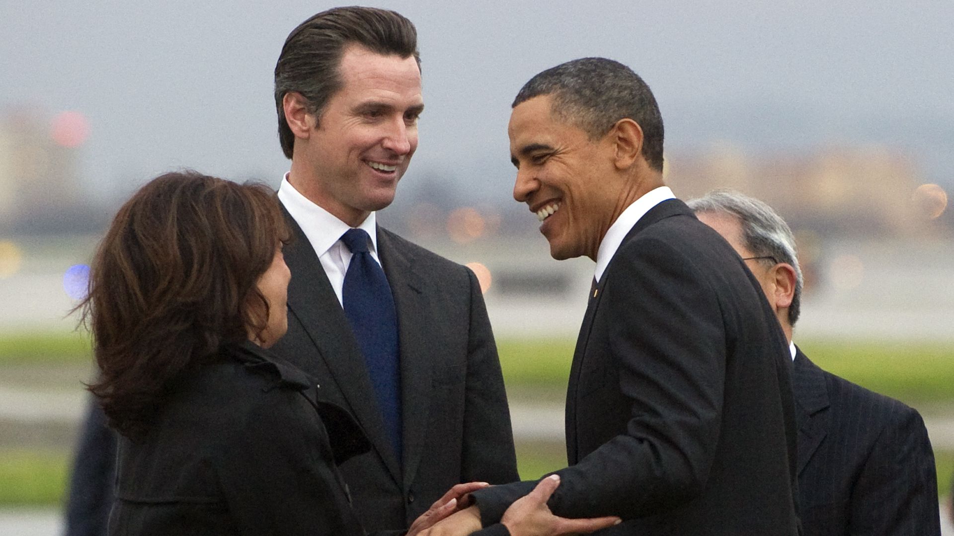 Then- President Barack Obama greets Kamala Harris (L) and Gavin Newsom in California in 2011
