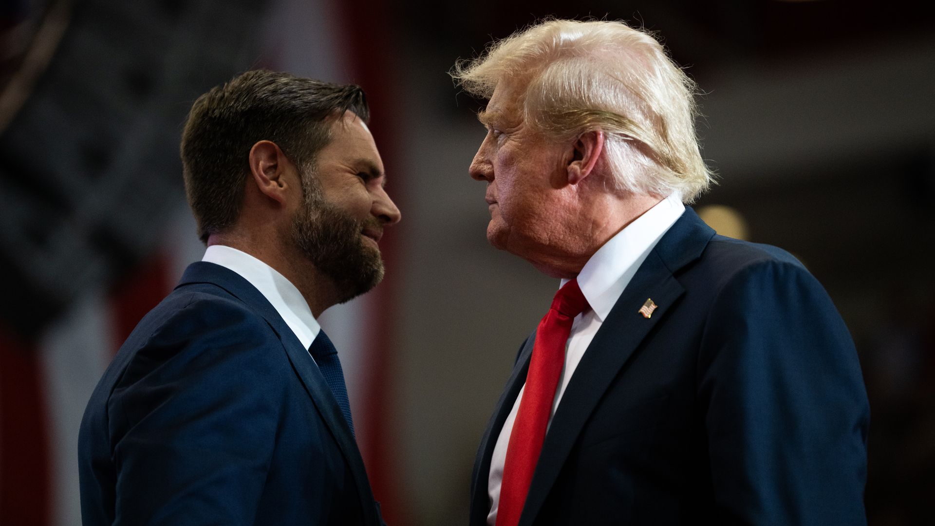 Former President Trump walks by his running mate, Ohio Sen. JD Vance