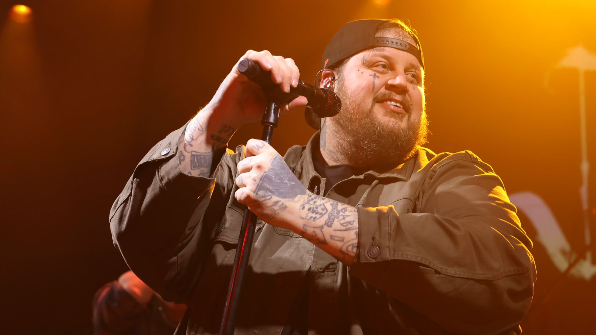 Singer Jelly Roll smiles during a performance