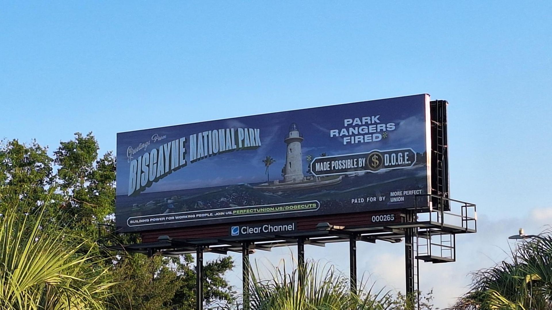 A billboard highlighting cuts at Biscayne National Park