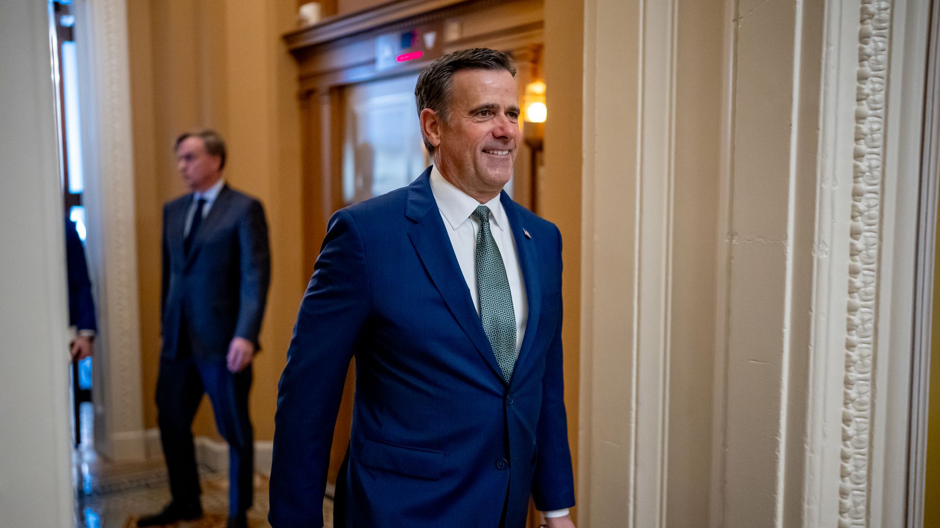 John Ratcliffe walks out of a meeting with Senate Minority Whip John Thune in December 2024.