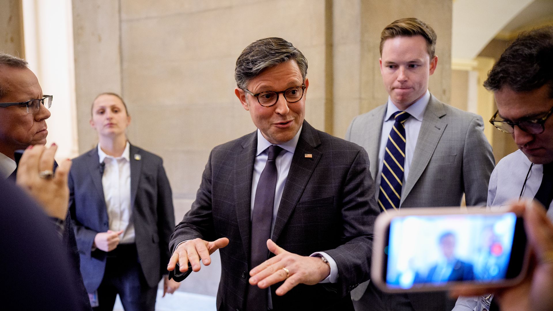 Speaker Johnson speaking with reporters outside of his office in the Capitol 