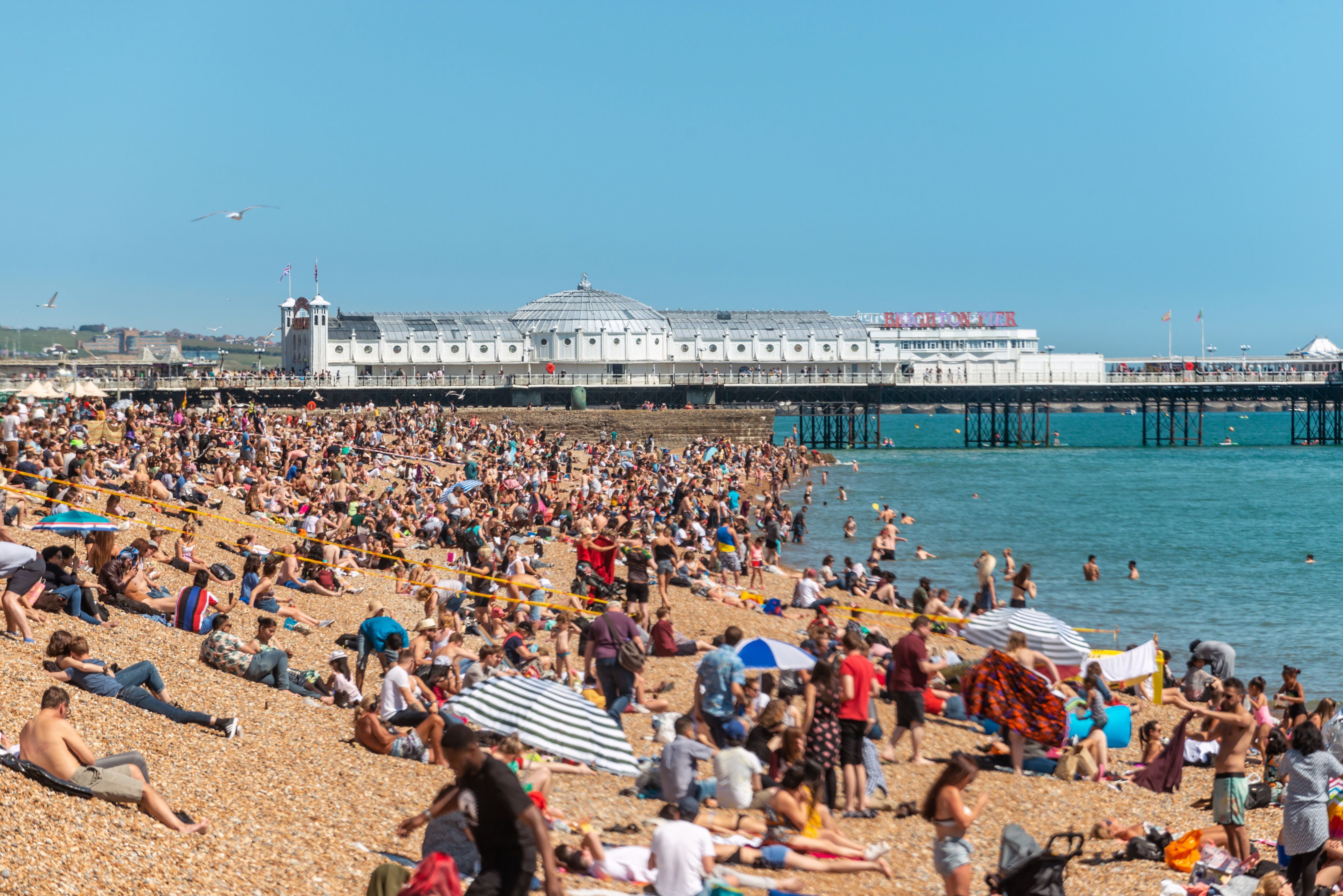 Crowds on the pebble beach in Brighton, on England's south coast. 
