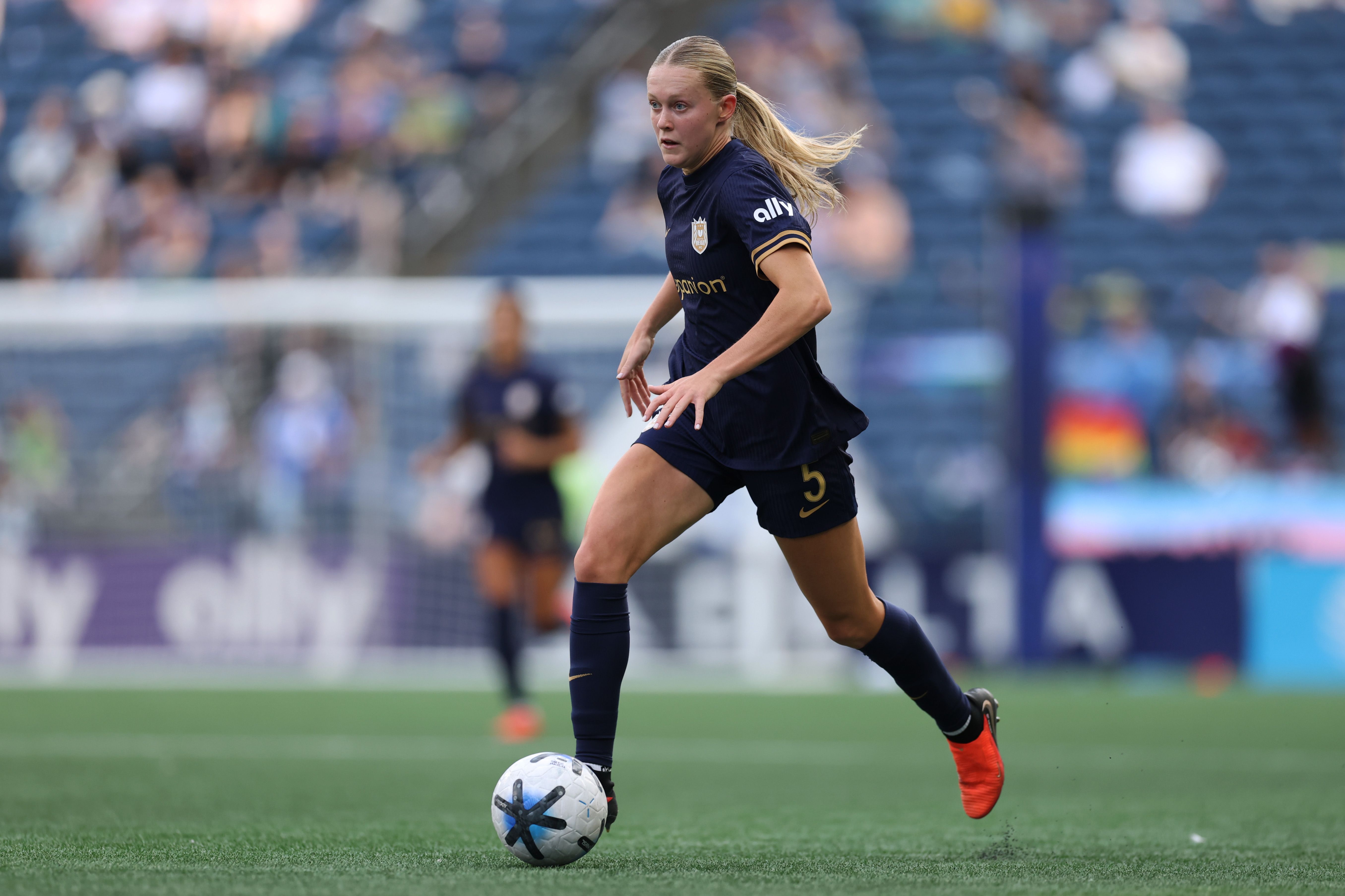 Seattle Reign rookie Maddie Dahlien dribbles the ball during Sunday's match against the Houston Dash at Lumen Field.