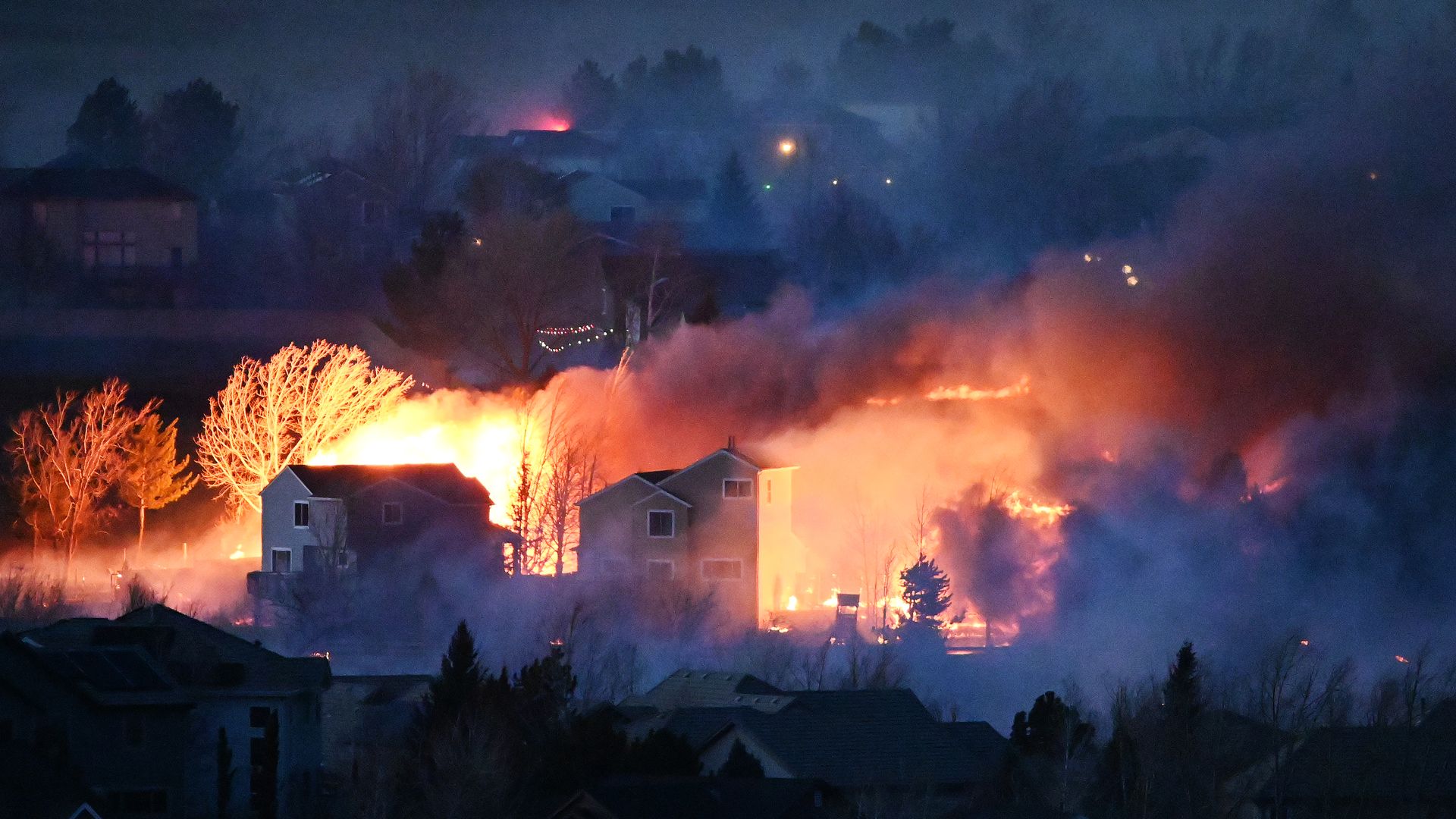 Picture of homes burning during a wildfire in Colorado on Dec. 30, 2021.