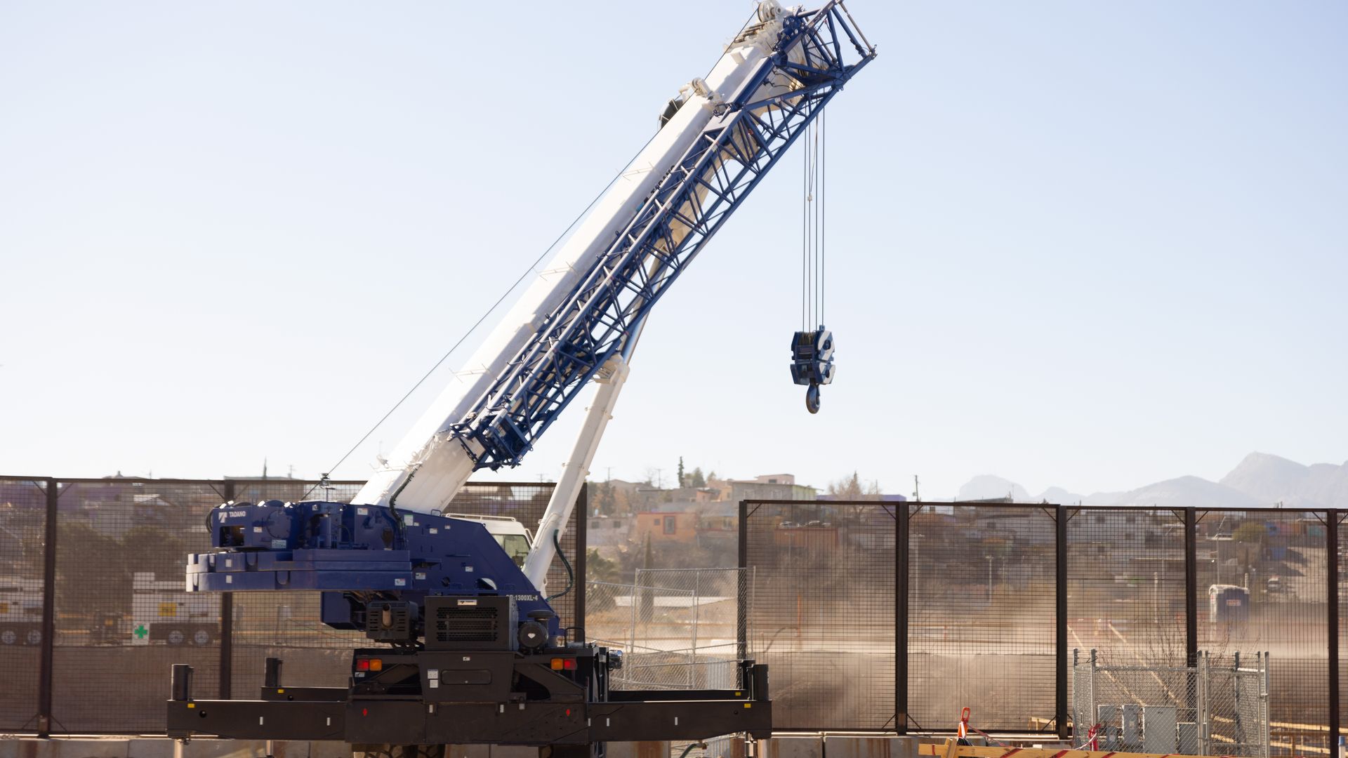 Construction equipment near a wall