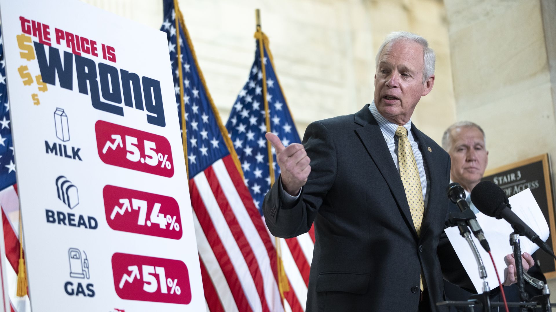 Republicans are seen with a sign highlighting recent consumer price hikes.