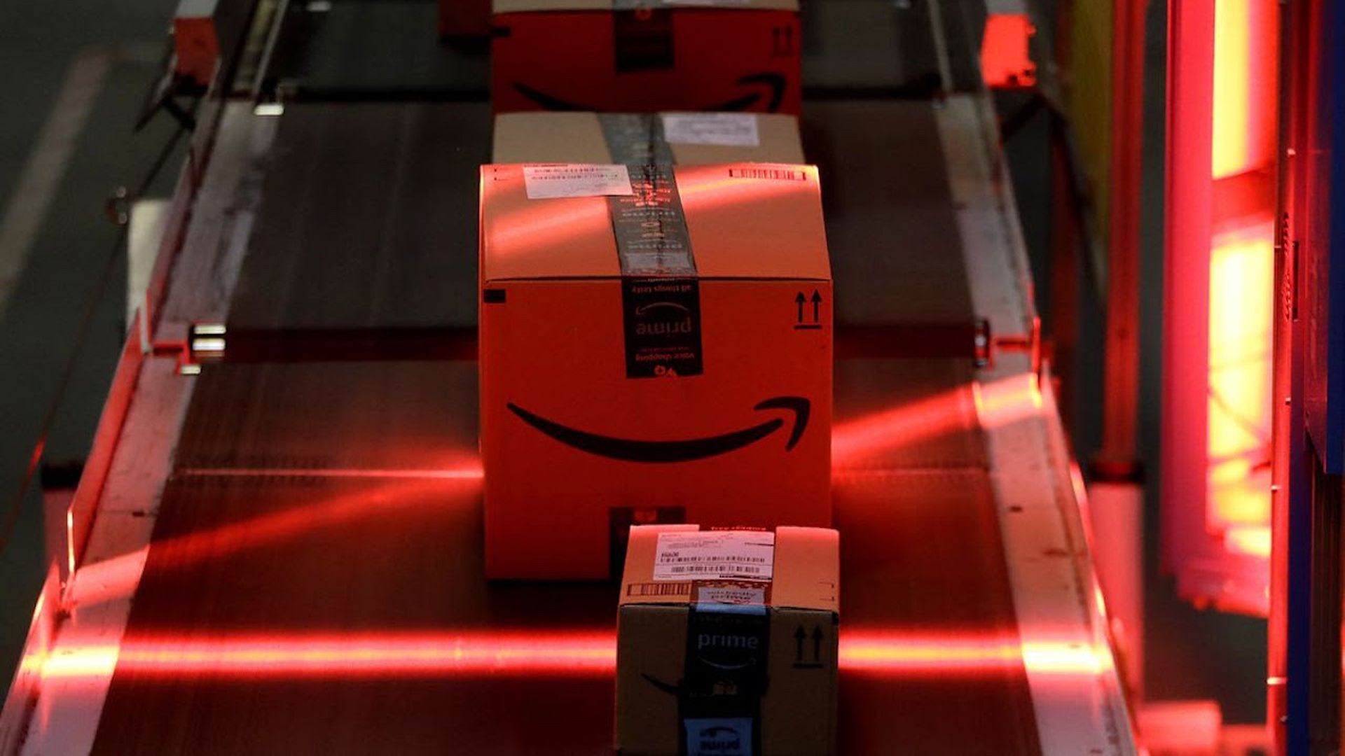 Amazon packages on a conveyor belt.