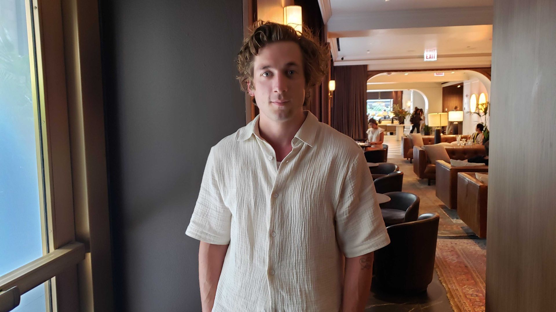 Photo of a man posing in a white shirt