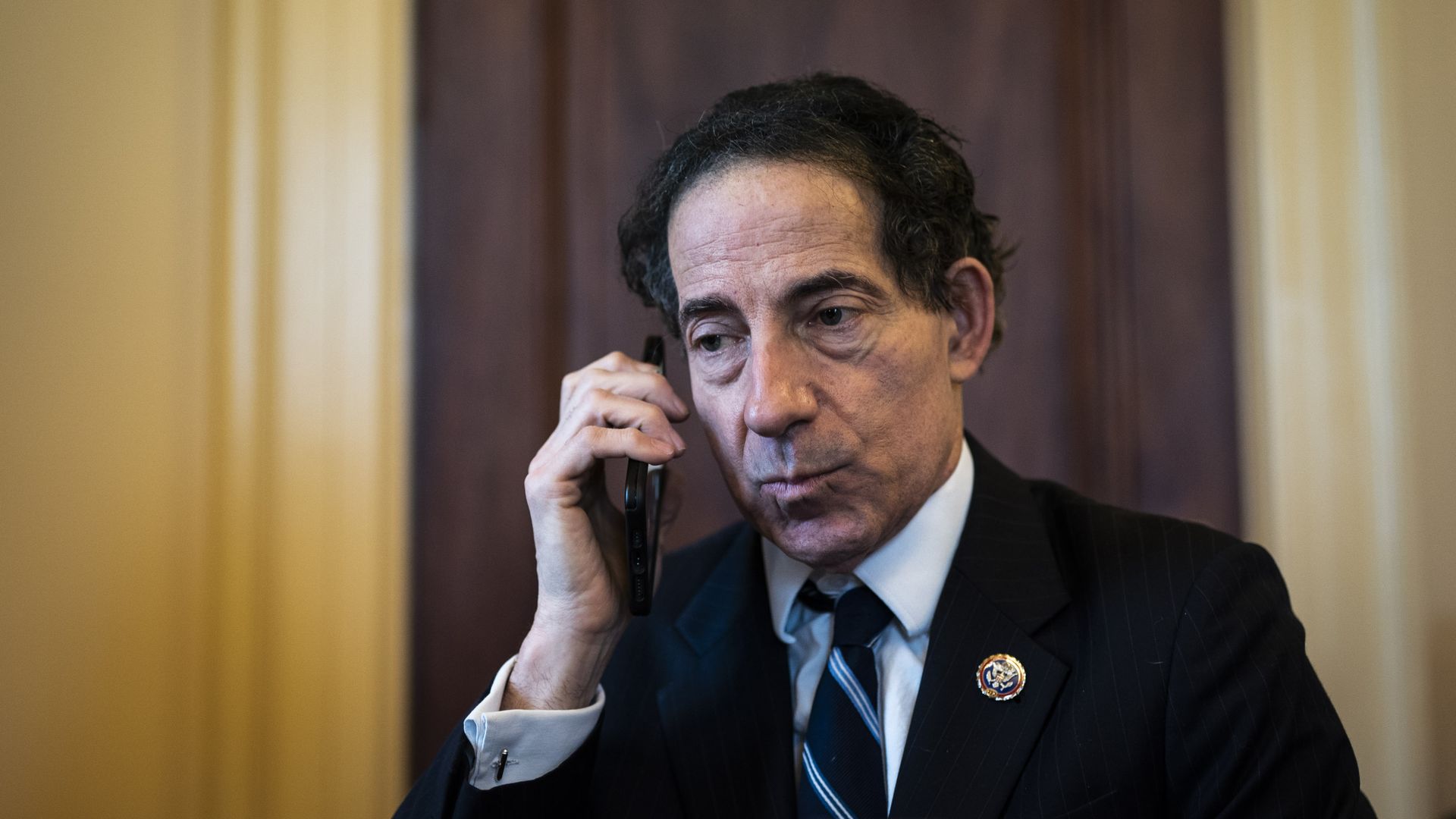 Jamie Raskin talks on a cell phone 