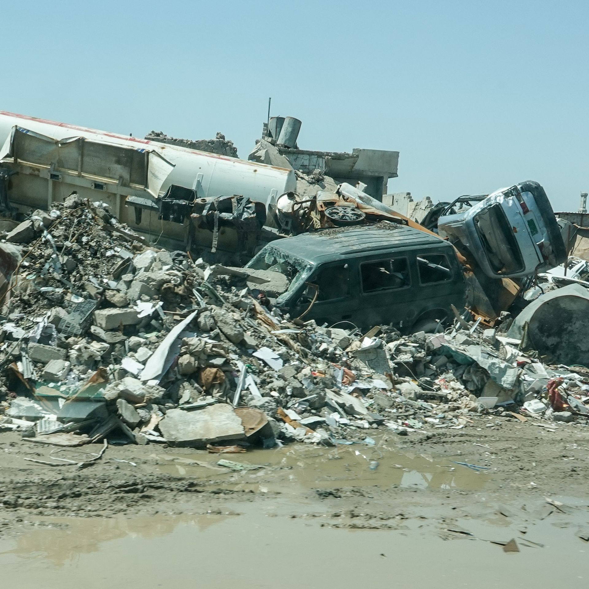  Houses and cars are that were destroyed by the Islamic State litter the city with debris. 