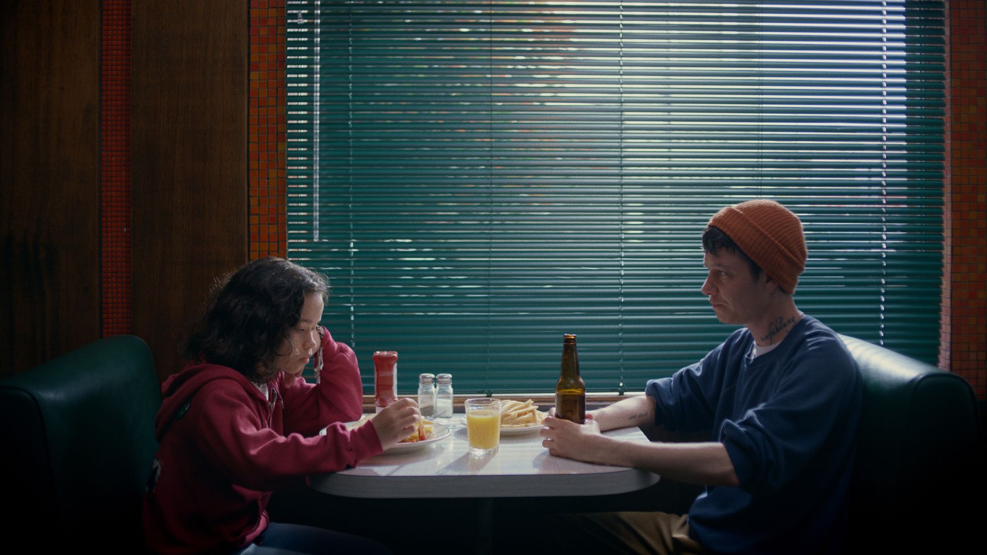 11-year old Ari and Cass sit at a diner in San Francisco as part of the movie Outerlands.