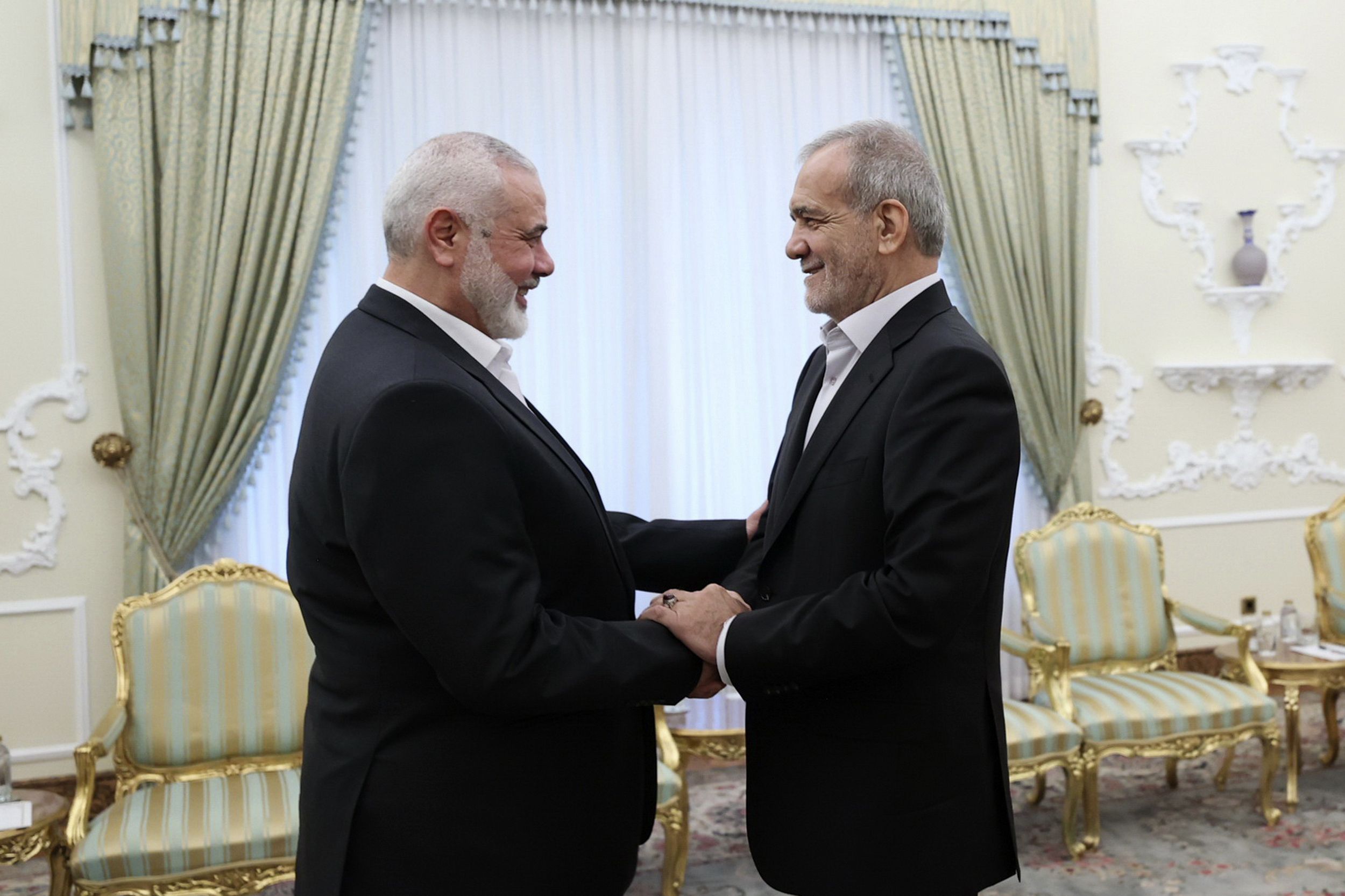Hamas political leader Ismail Haniyeh meets with new Iranian President Masoud Pezeshkian in Tehran yesterday.