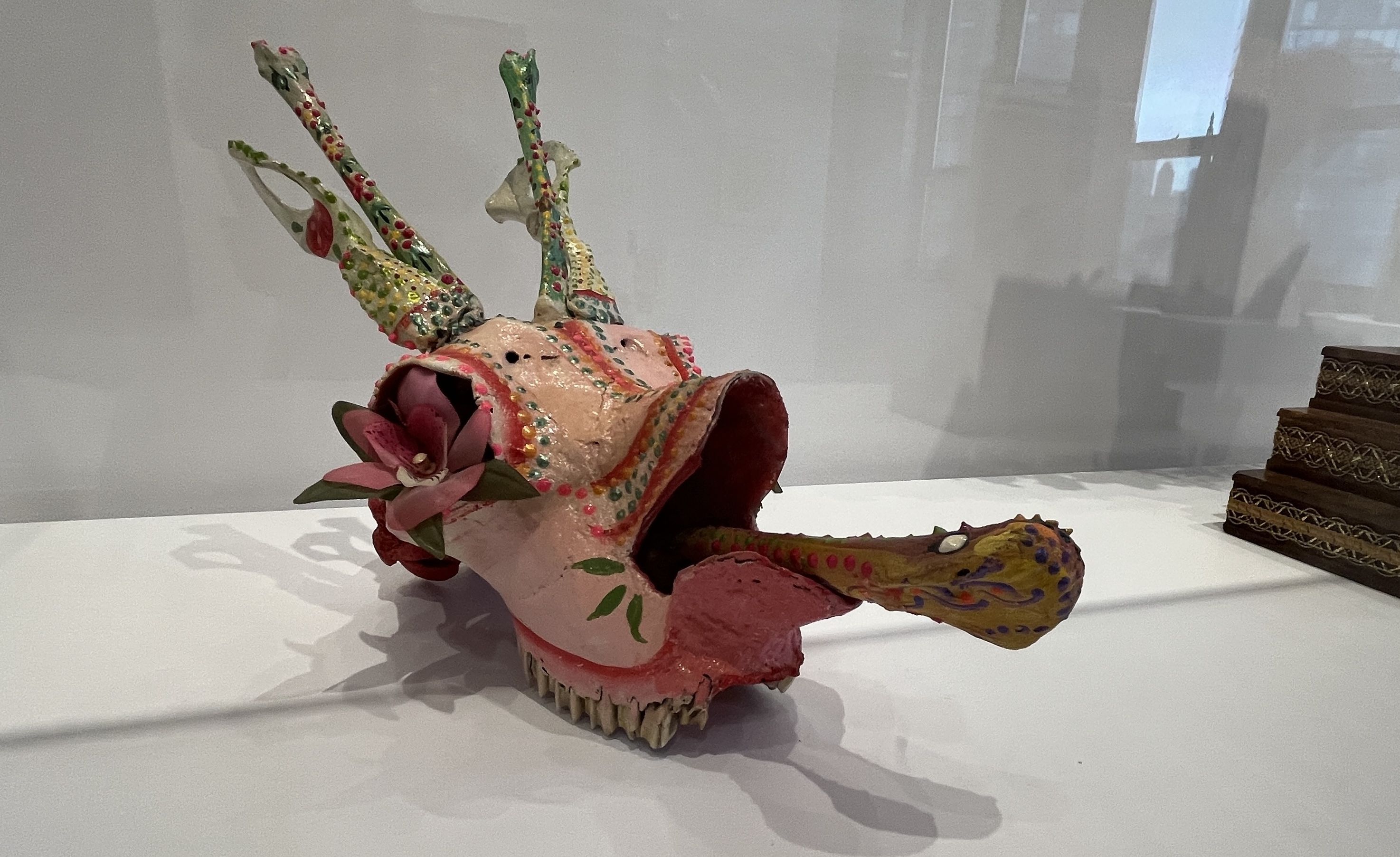 Sculpture of a multi-colored goat head