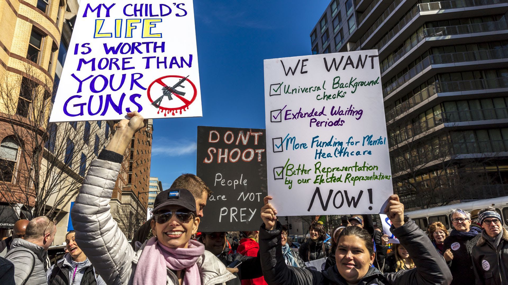 Protestors holding signs