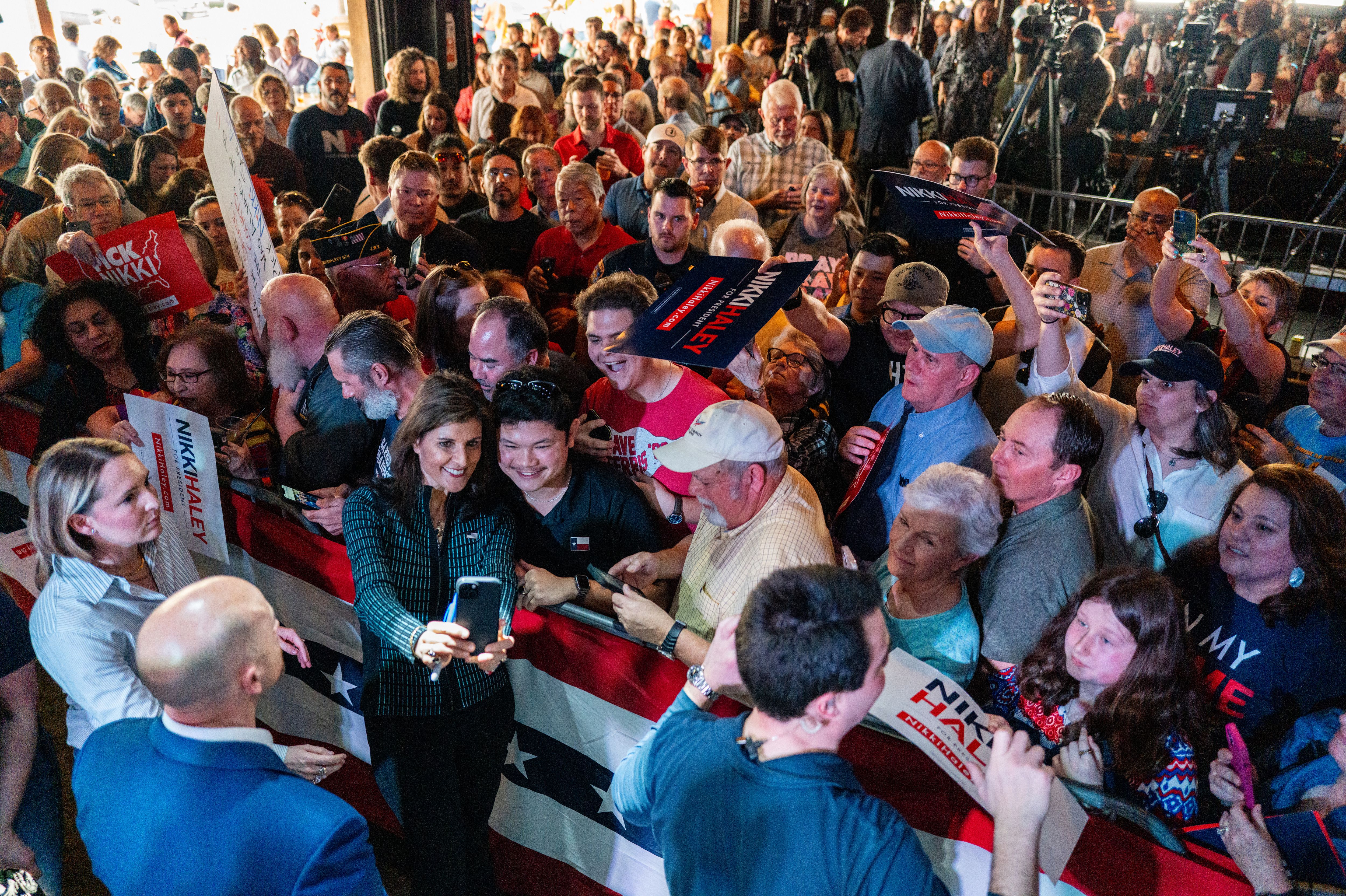 Nikki Haley with a crowd of supporters in a bird's eye view photo