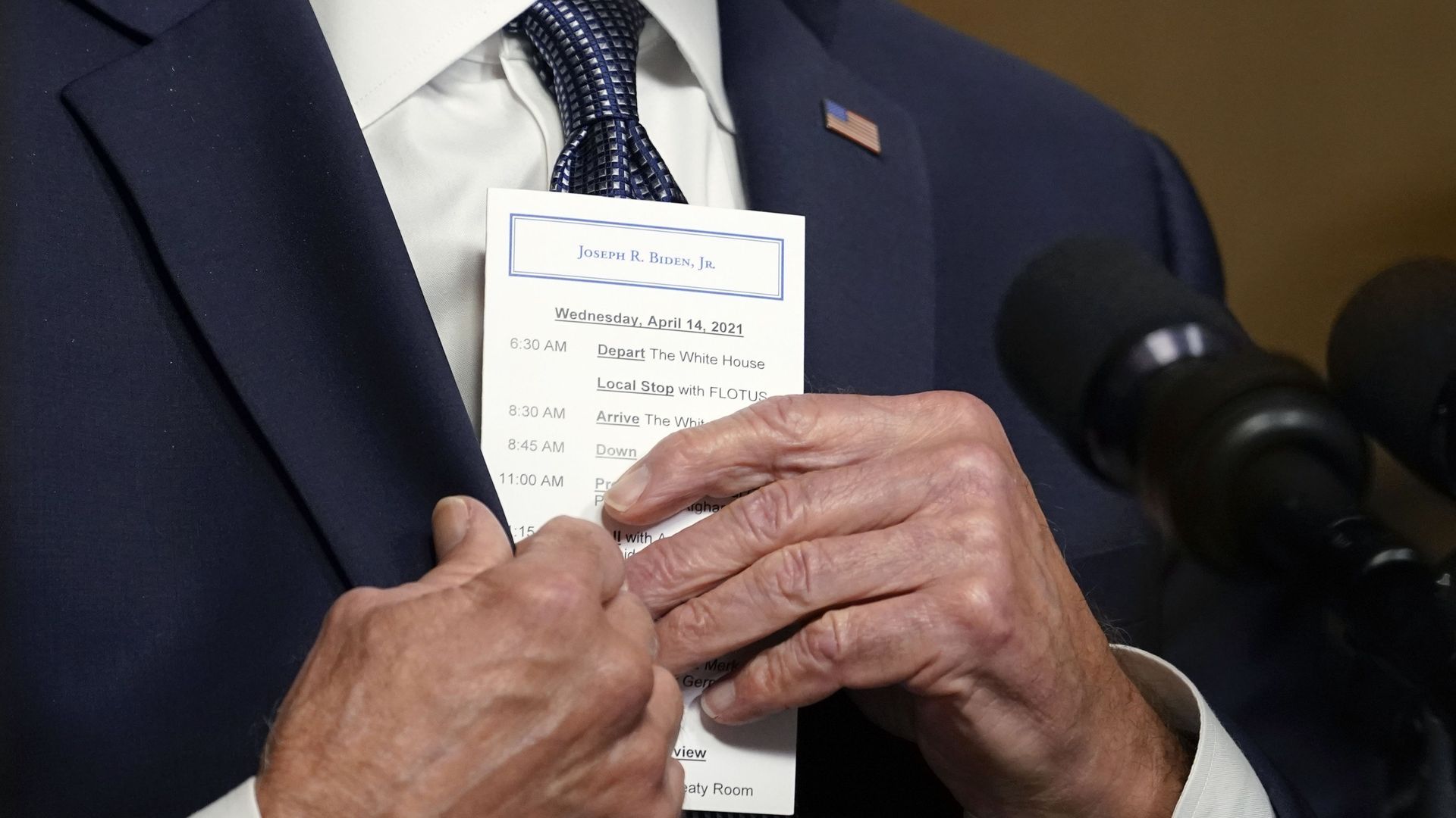 Biden holding an itinerary