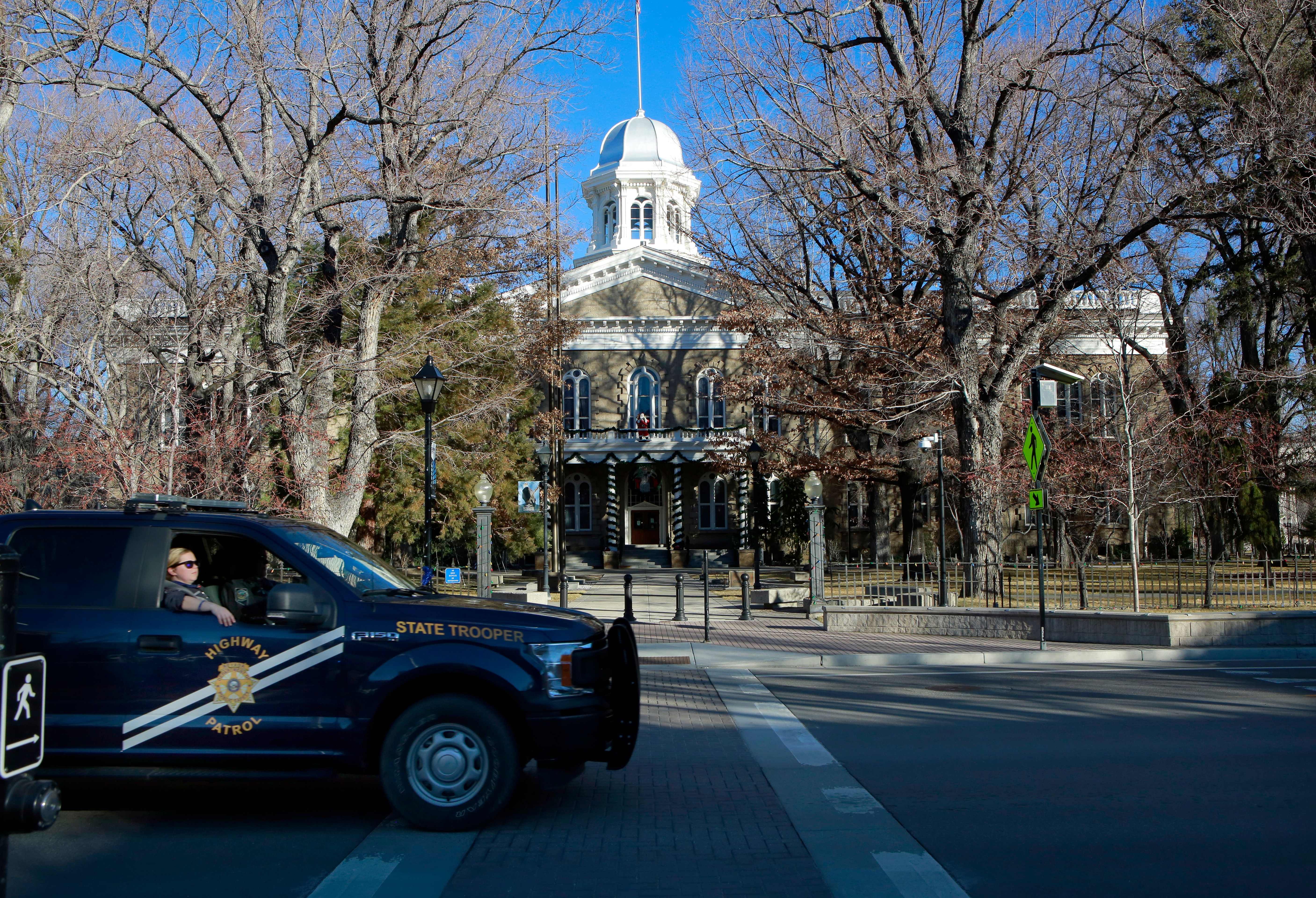 A Nevada Highway Patrol vehicle passes by the State Capitol on January 17, 2021, in Carson City