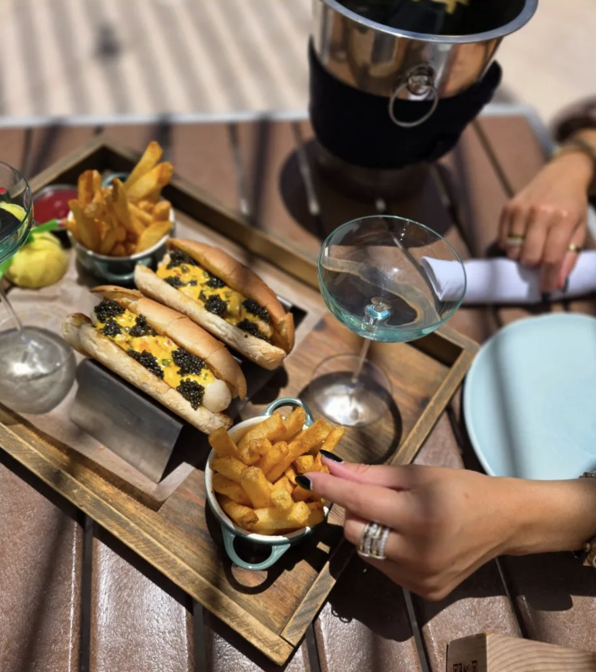 A bird's eye view of two hot dogs, fries and drinks