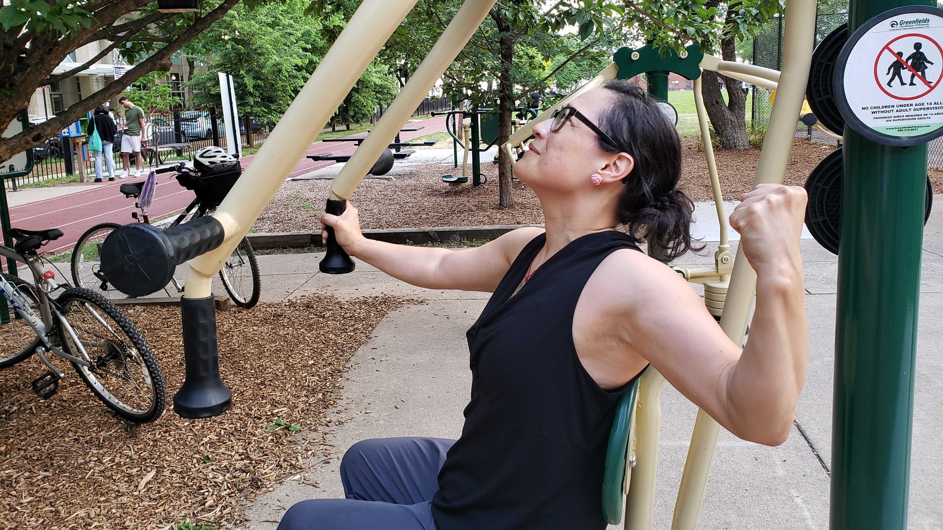 Photo of a woman working out in a park. 