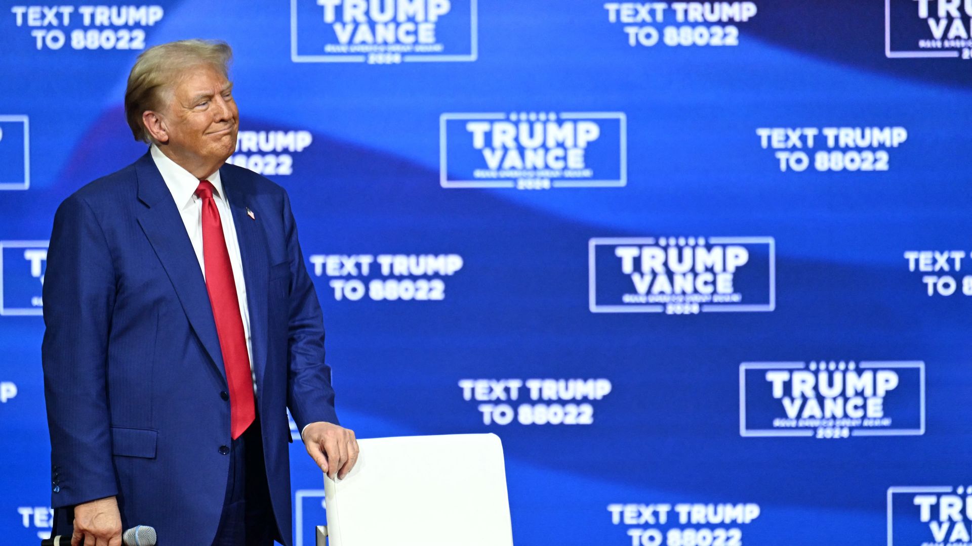 Former US President and Republican presidential candidate Donald Trump listens during a town hall at the Greater Philadelphia Expo Center and Fairgrounds in Oaks, Pennsylvania, on October 14, 2024. 