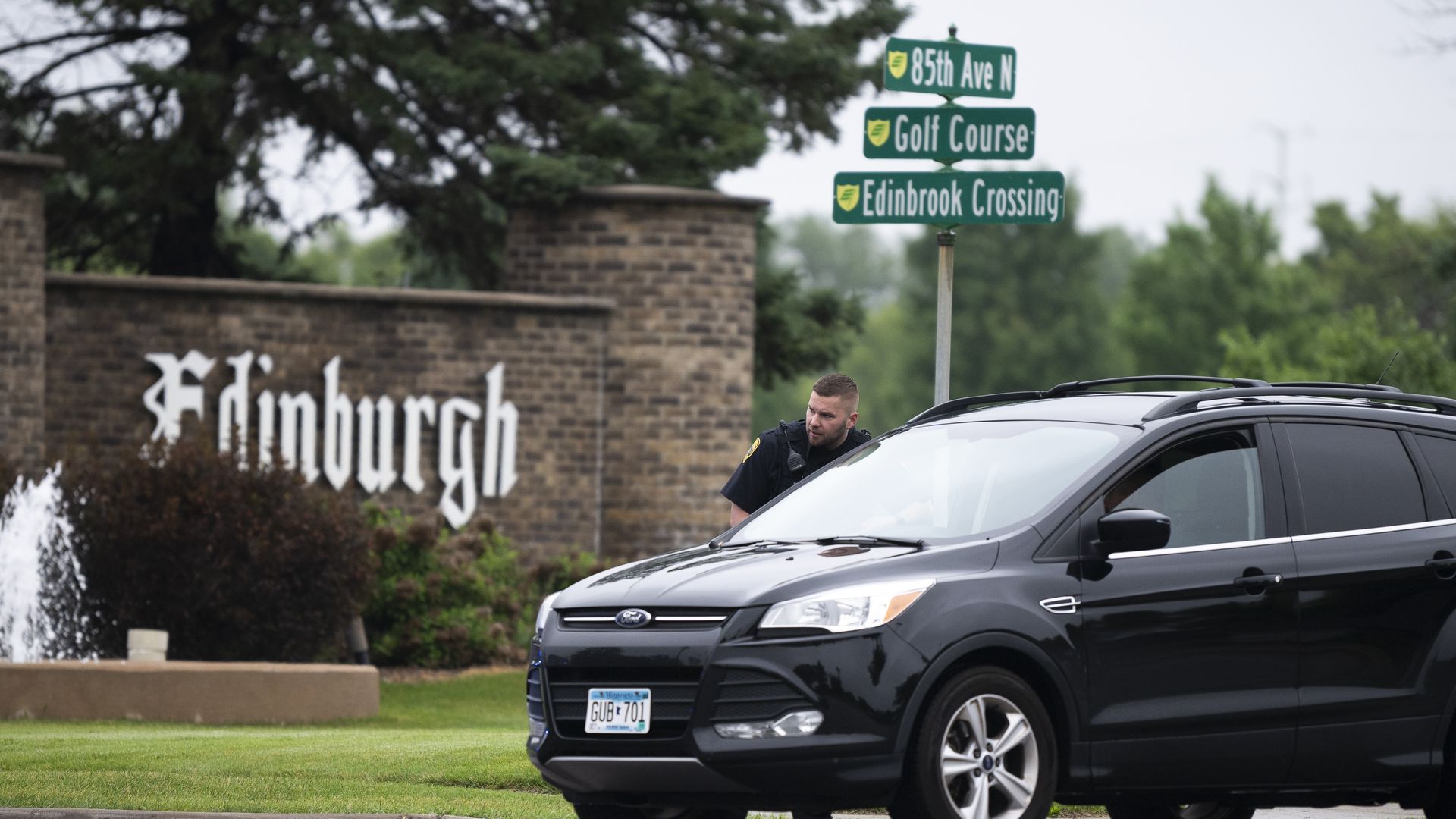  A Brooklyn Park police officer speaks with the driver of a vehicle entering a neighborhood on June 14, 2025 in Brooklyn Park, Minnesota. Democratic-Farmer-Labor State Rep. Melissa Hortman and her husband were shot and killed this morning.