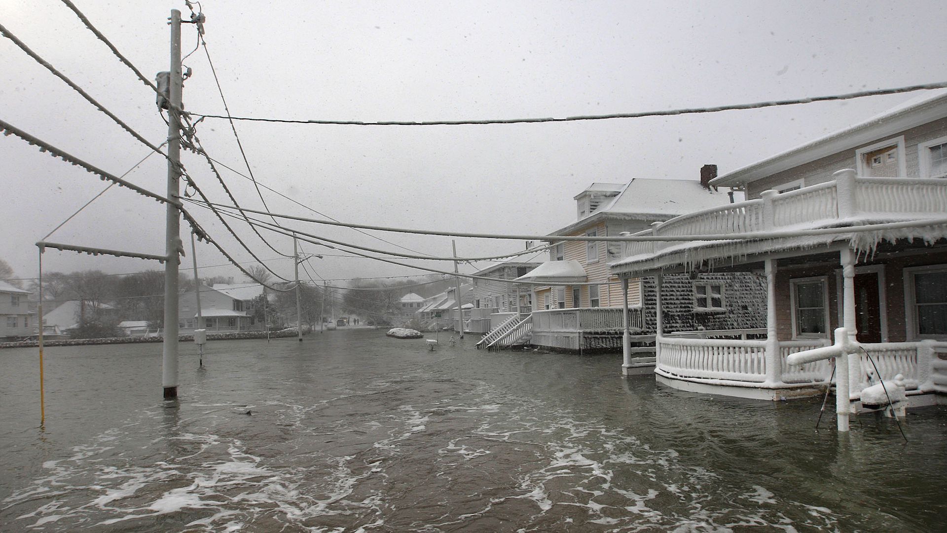 Photo of a flooded street after a coastal storm at Turner Road in Scituate, Mass.