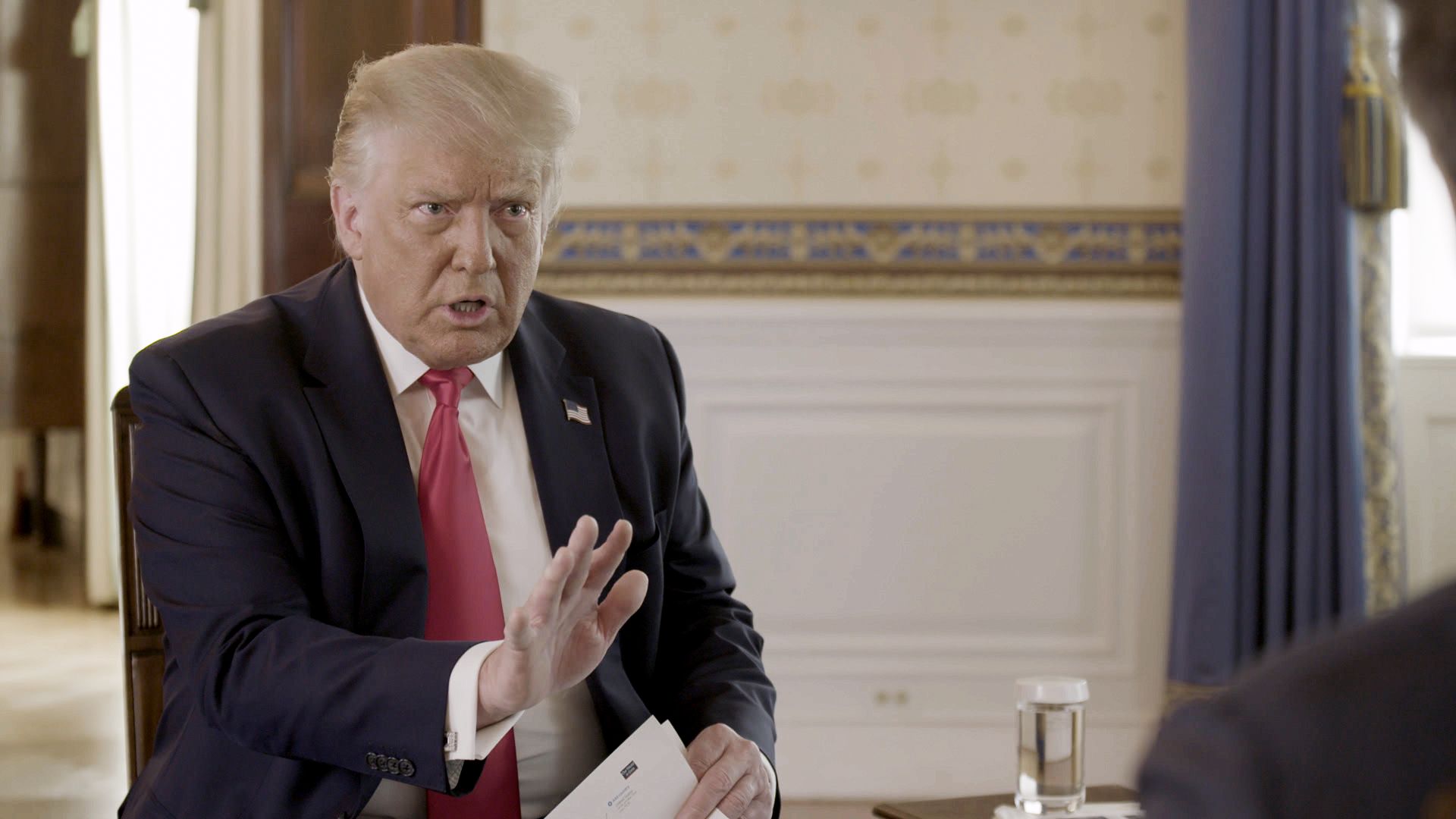 President Trump gestures as he talks during an Axios on HBO interview
