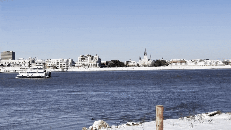 Image shows a tugboat in the Mississippi River between the French Quarter and Algiers Point.