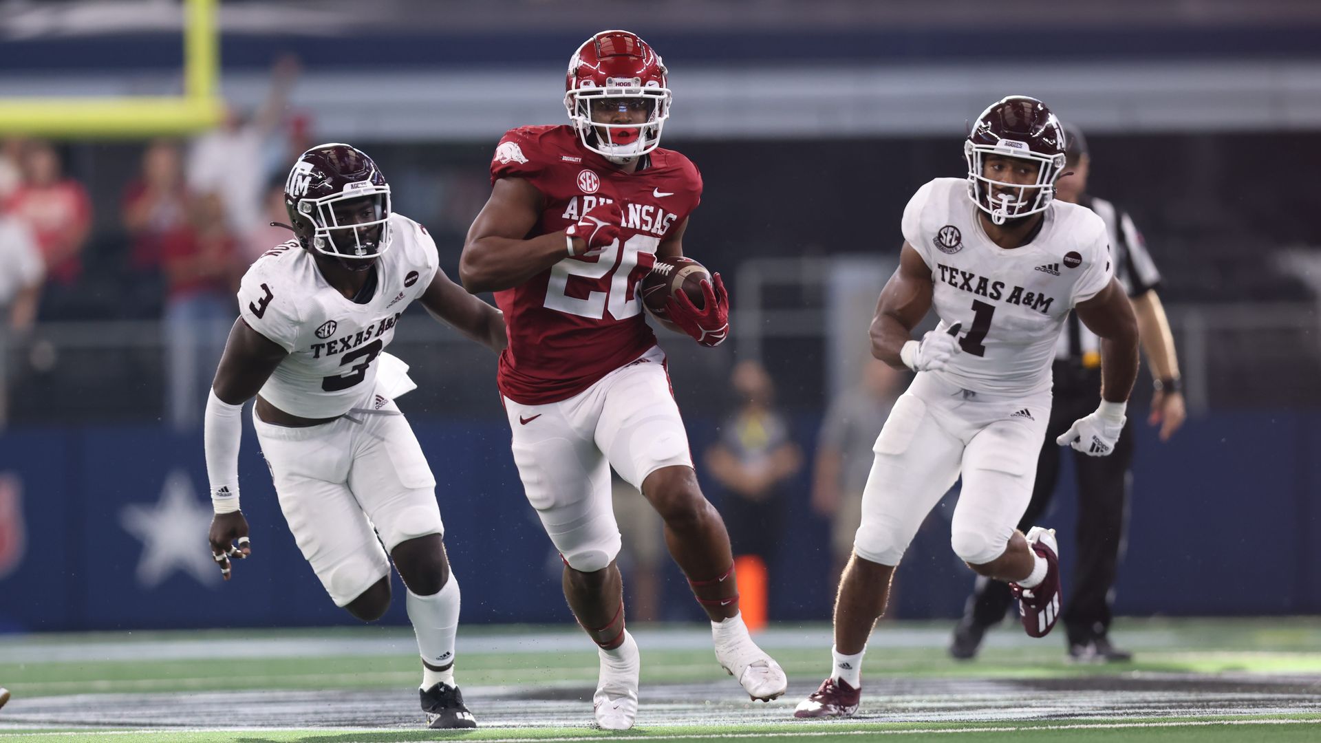 Arkansas Razorbacks running back Dominique Johnson (20) runs the ball in the Southwest Classic between the Arkansas Razorbacks and the Texas A&M Aggies.