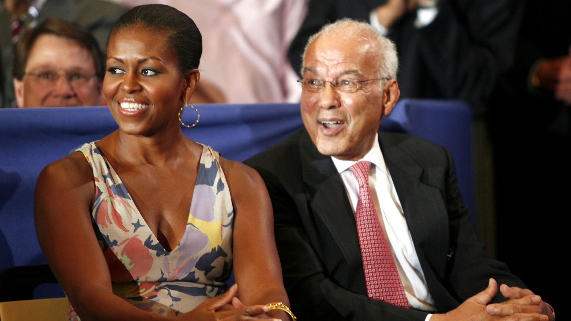 Image shows Norman Francis smiling and sitting next to Michelle Obama.