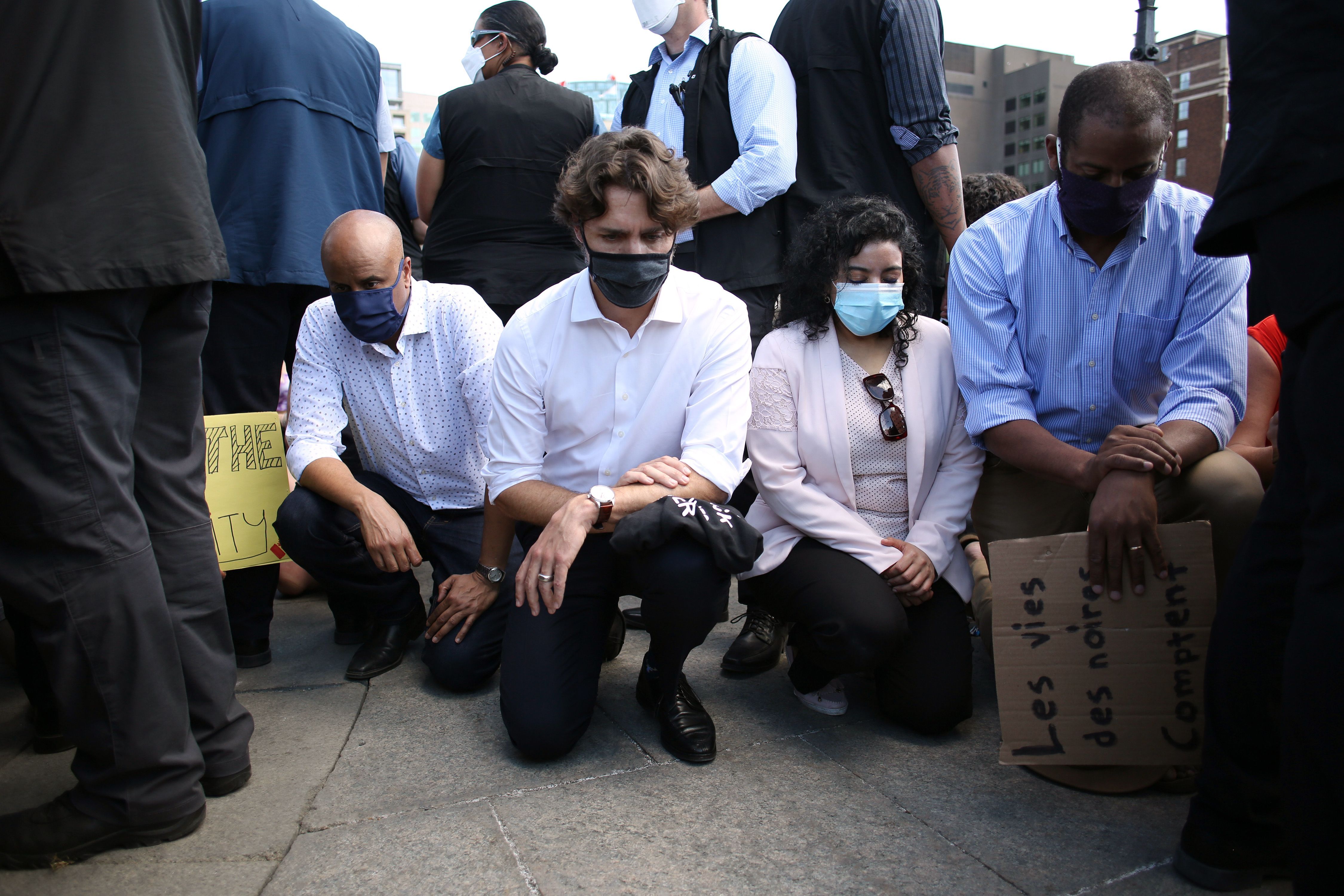  Canadian Prime Minister Justin Trudeau (2nd L) takes a knee during in a Black Lives Matter protest 