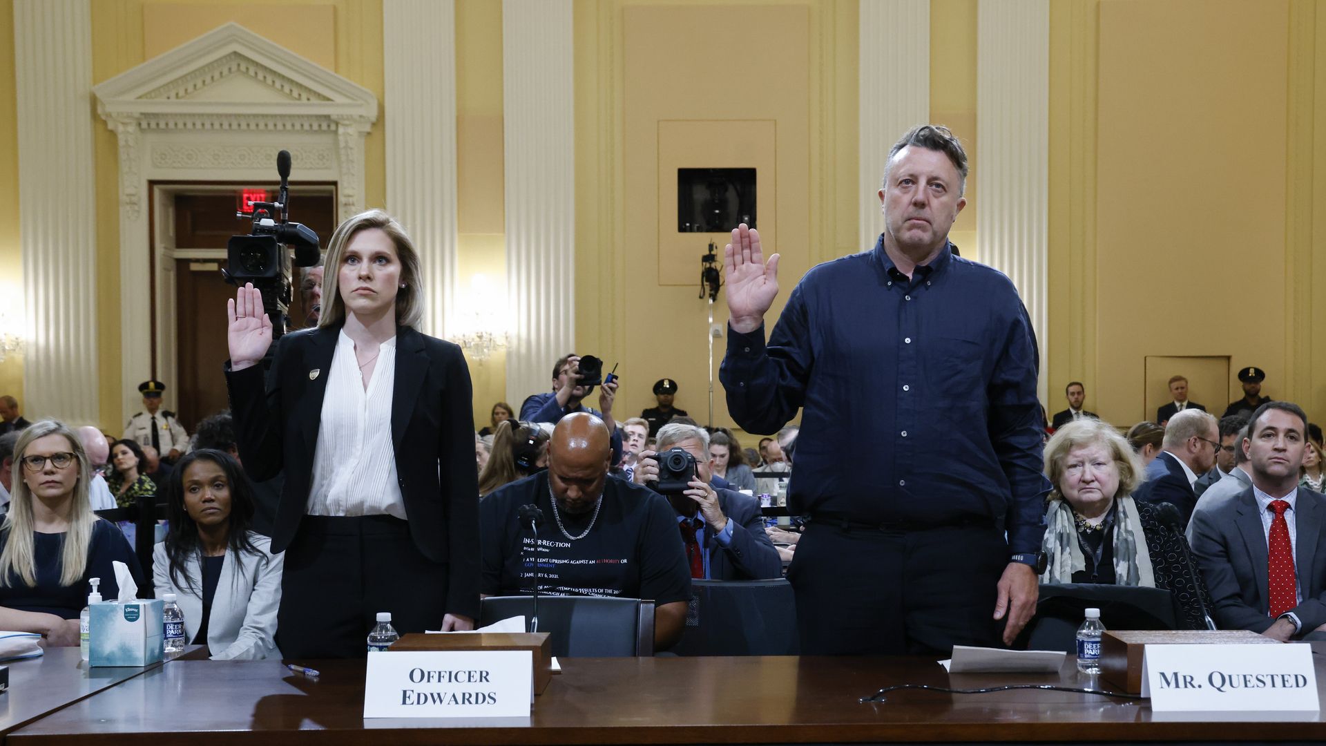 Caroline Edwards, a US Capitol Police officer injured in the Jan. 6 riot, left, and filmmaker Nick Quested, swear in to a hearing of the Select Committee to Investigate the January 6th Attac