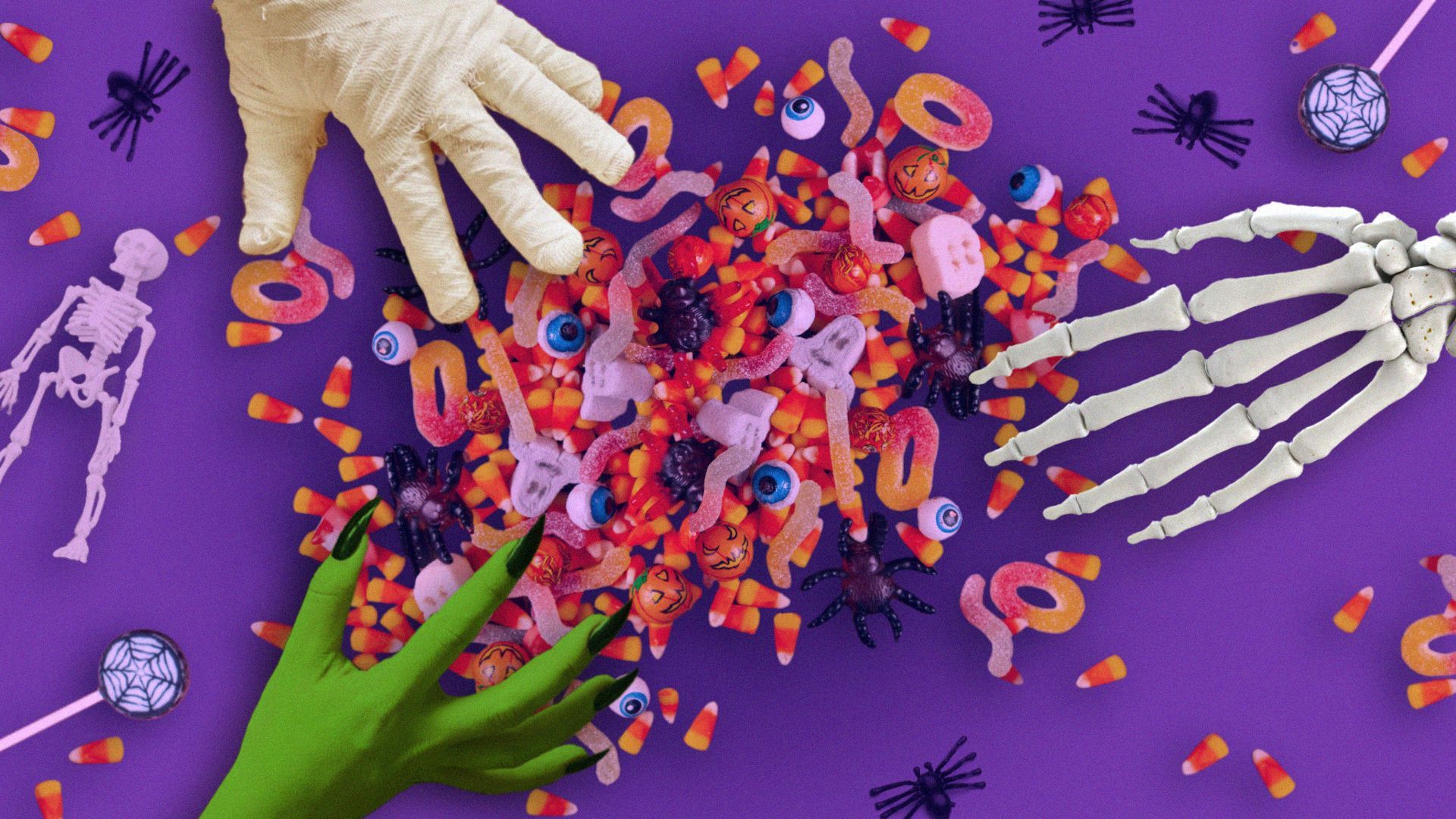 Kids dressed up for Halloween grabbing candy