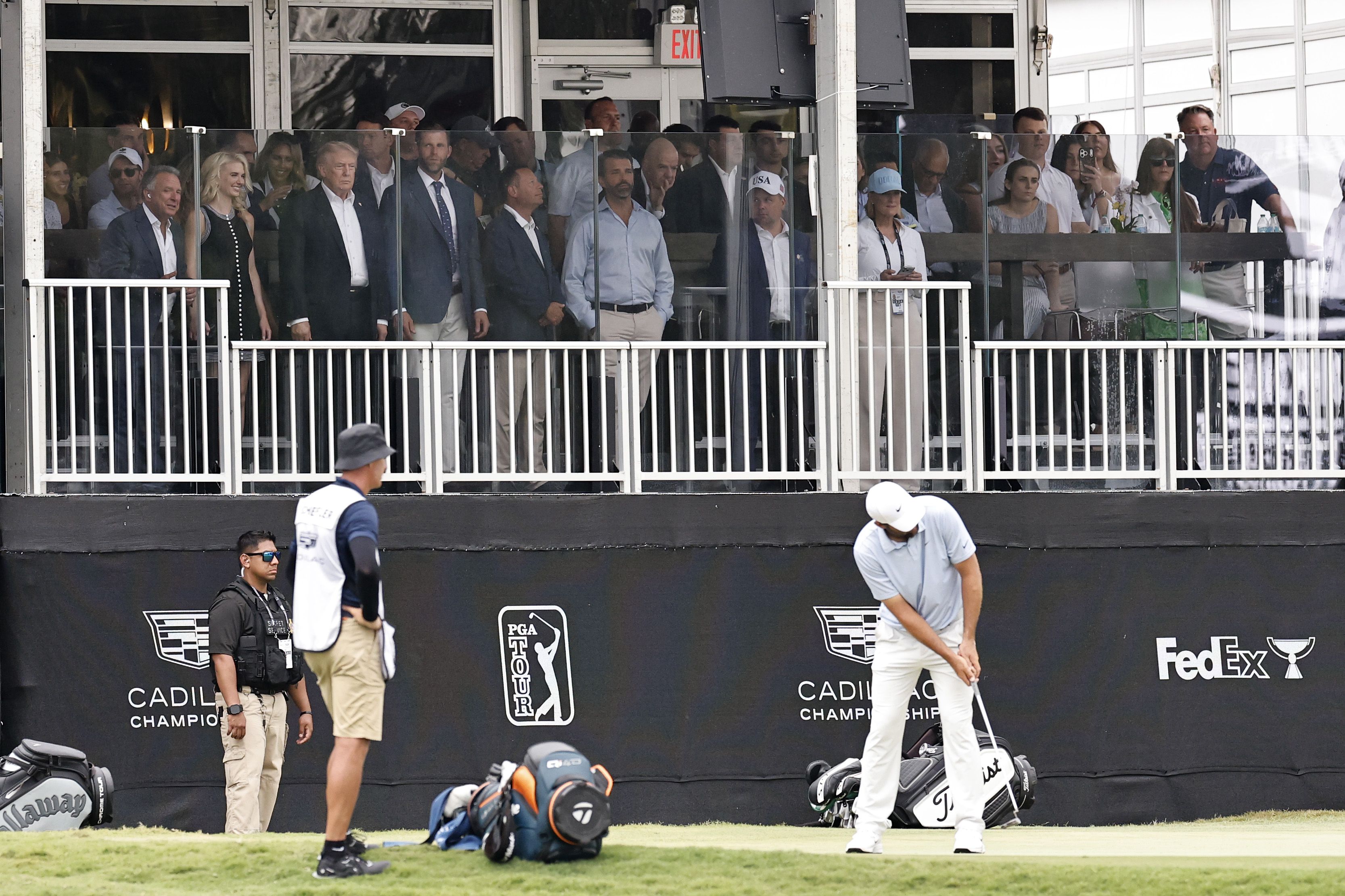 President Trump watches as Scottie Scheffler putts in the Cadillac Championship at his Doral golf club.