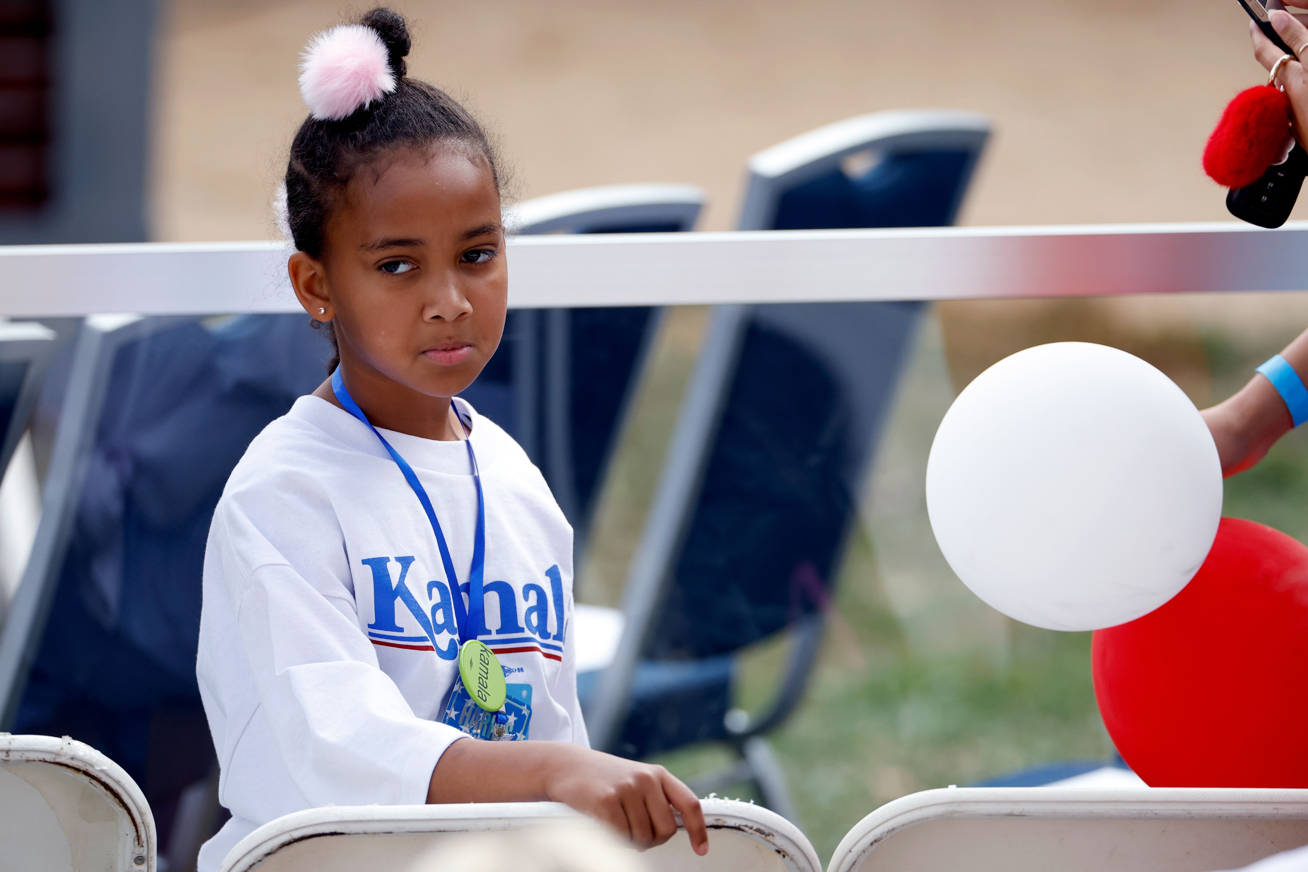A young girl waits to hear Democratic presidential nominee, U.S. Vice President Kamala Harris, speak on stage as she is expected to concede the election, at Howard University on November 06, 2024 in Washington, DC. 