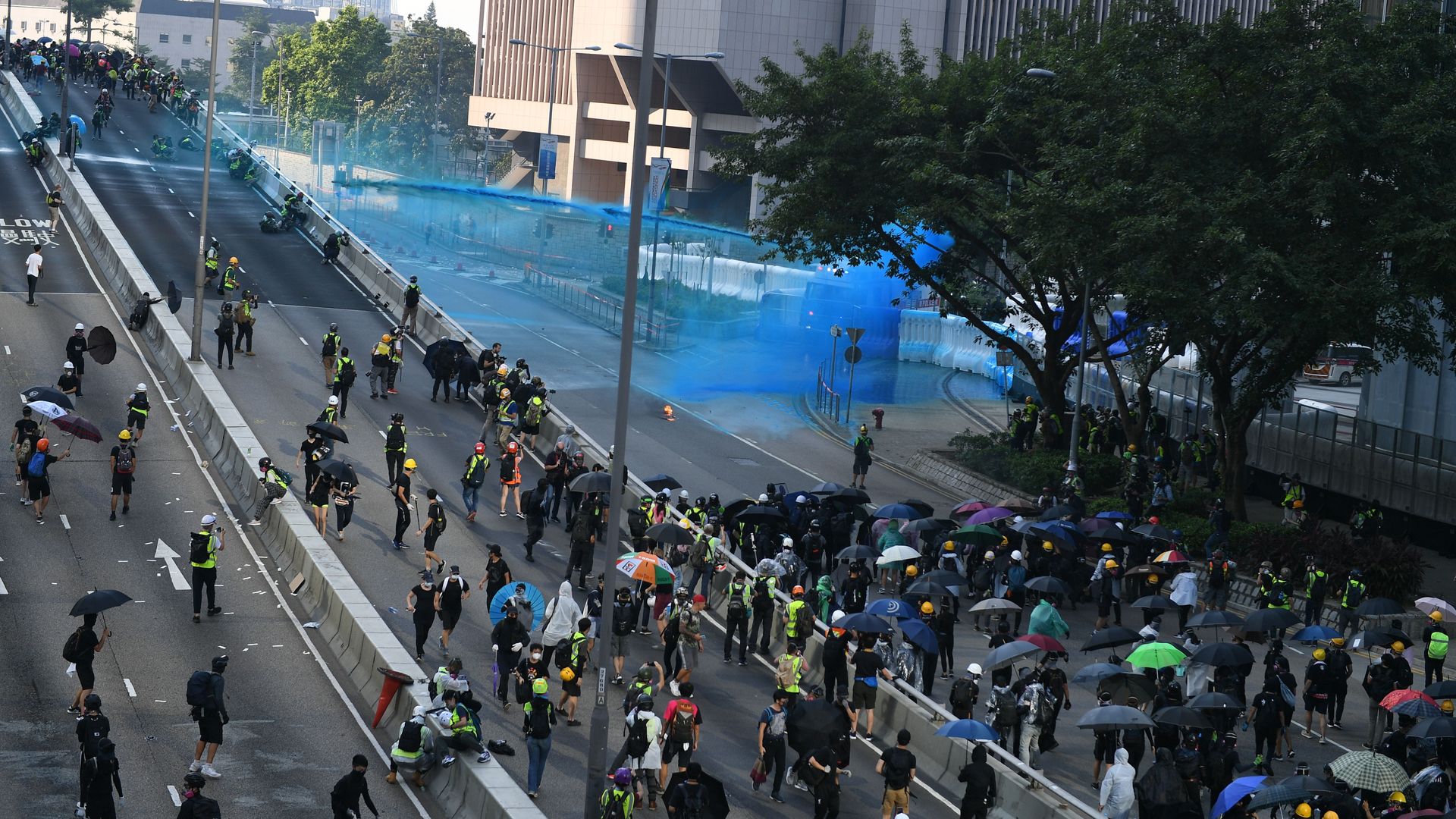 Hong Kong police fire water cannon from the central government complex