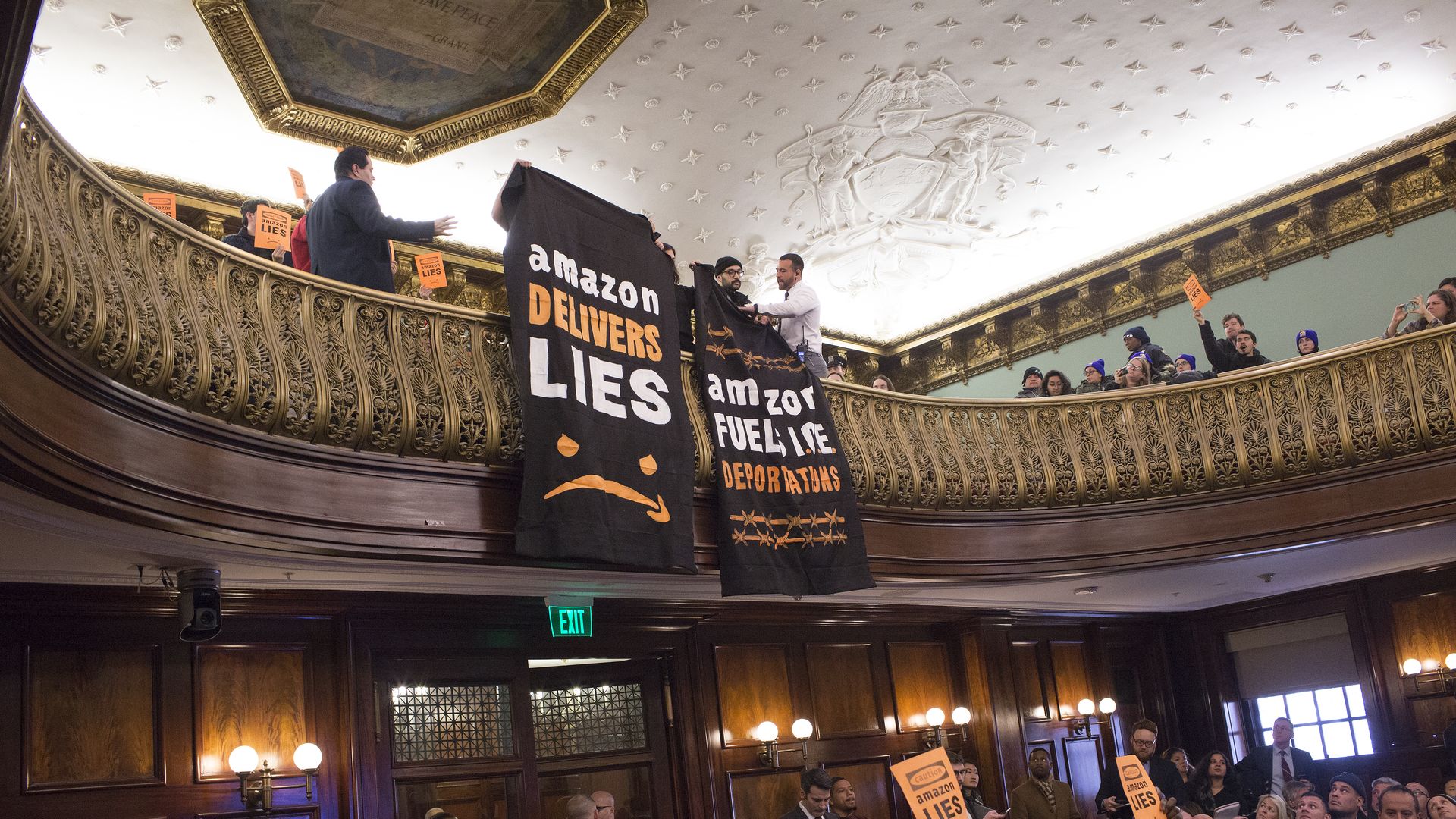 Photo of protestors at NYC council meeting on Amazon HQ2 at end of January 2019.