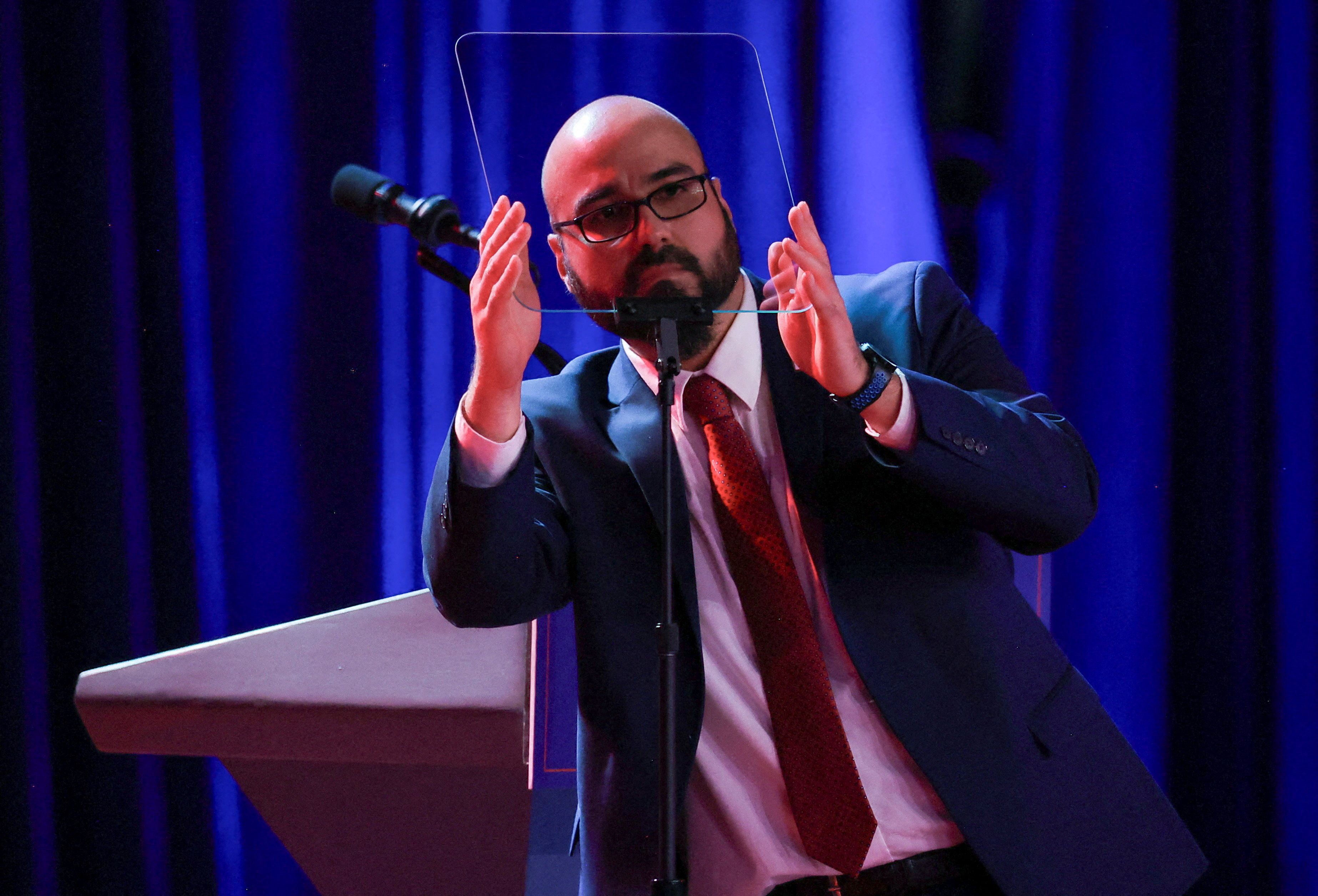 Gabriel Perez adjusts the teleprompter before Donald Trump arrives to speak on election night 2024 in West Palm Beach, Fla.