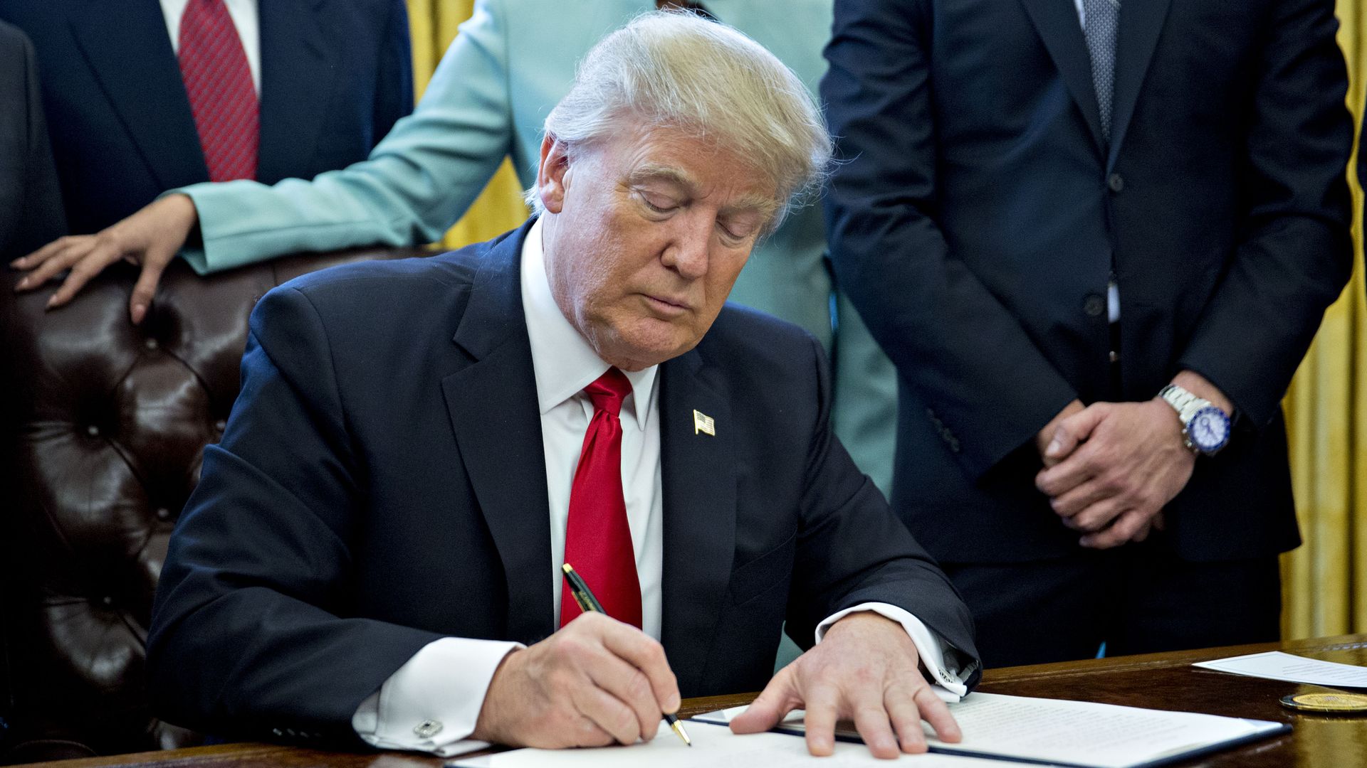 Trump signing an executive order