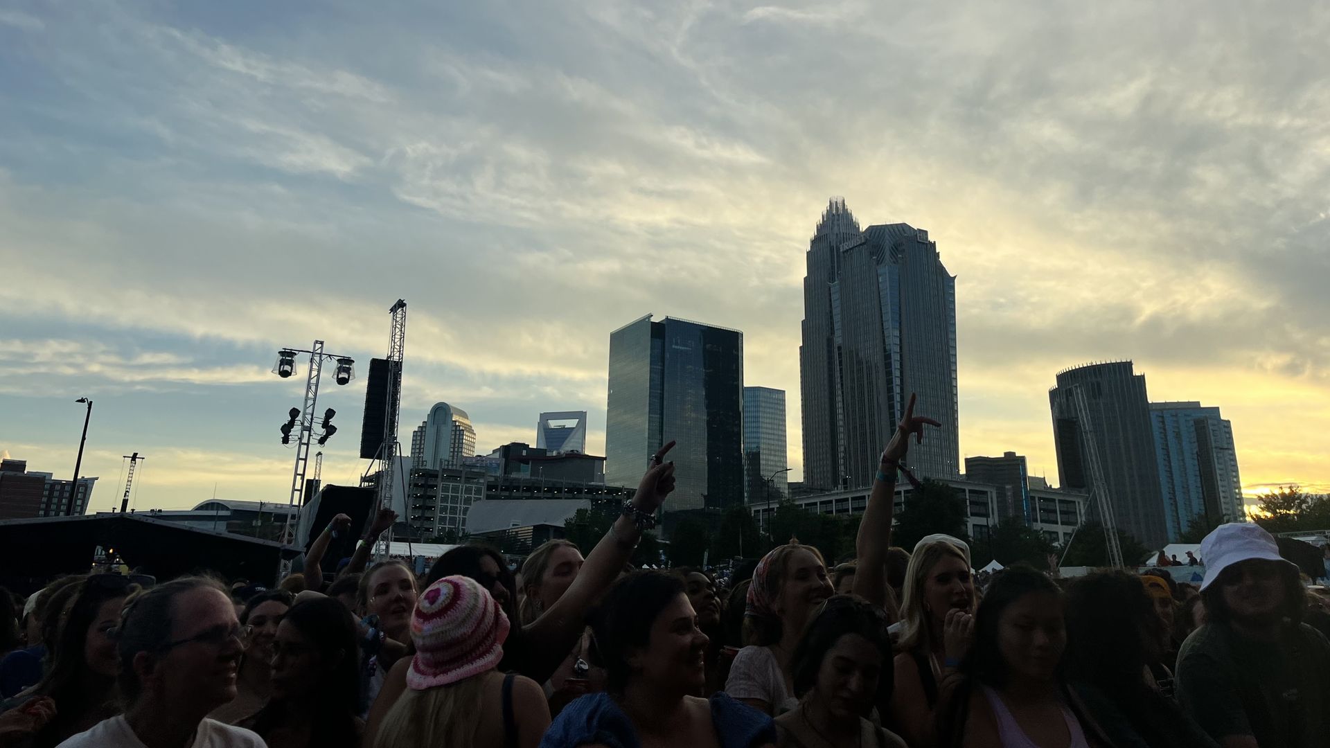 Crowd below Uptown skyline