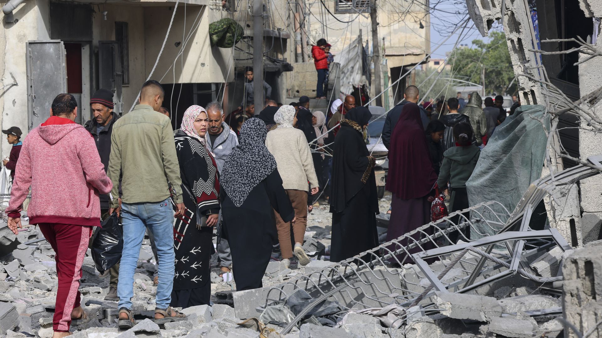 Palestinians inspect the rubble of buildings damaged during Israeli bombardment in Rafah. Photo: Said Khatib/AFP via Getty Images