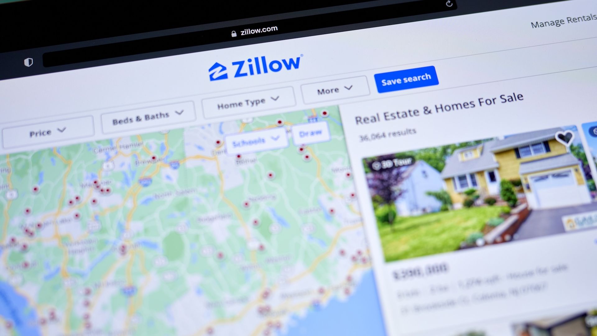 The home listing website Zillow with a map with red dots on it and a listing for a home for sale.