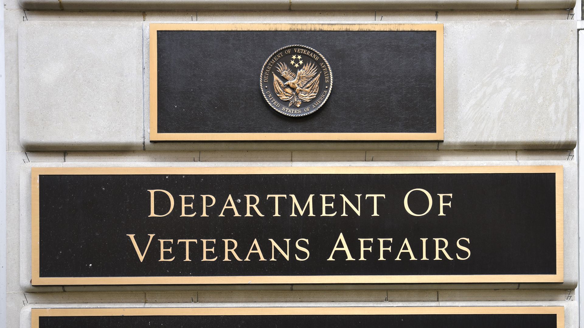 A metal plaque on the façade of the Department of Veterans Affairs building in Washington, D.C.