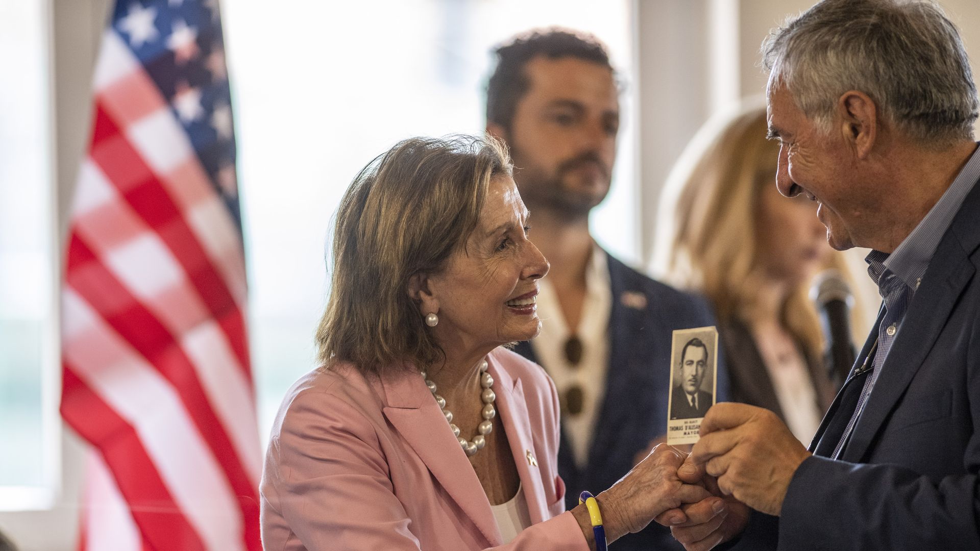 Nancy Pelosi showing a picture of her grandfather