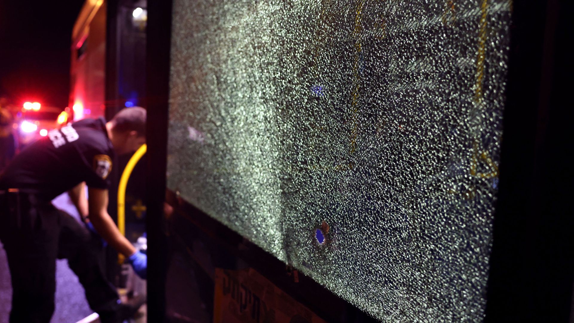 sraeli security inspect a bus after an attack outside Jerusalem's Old City