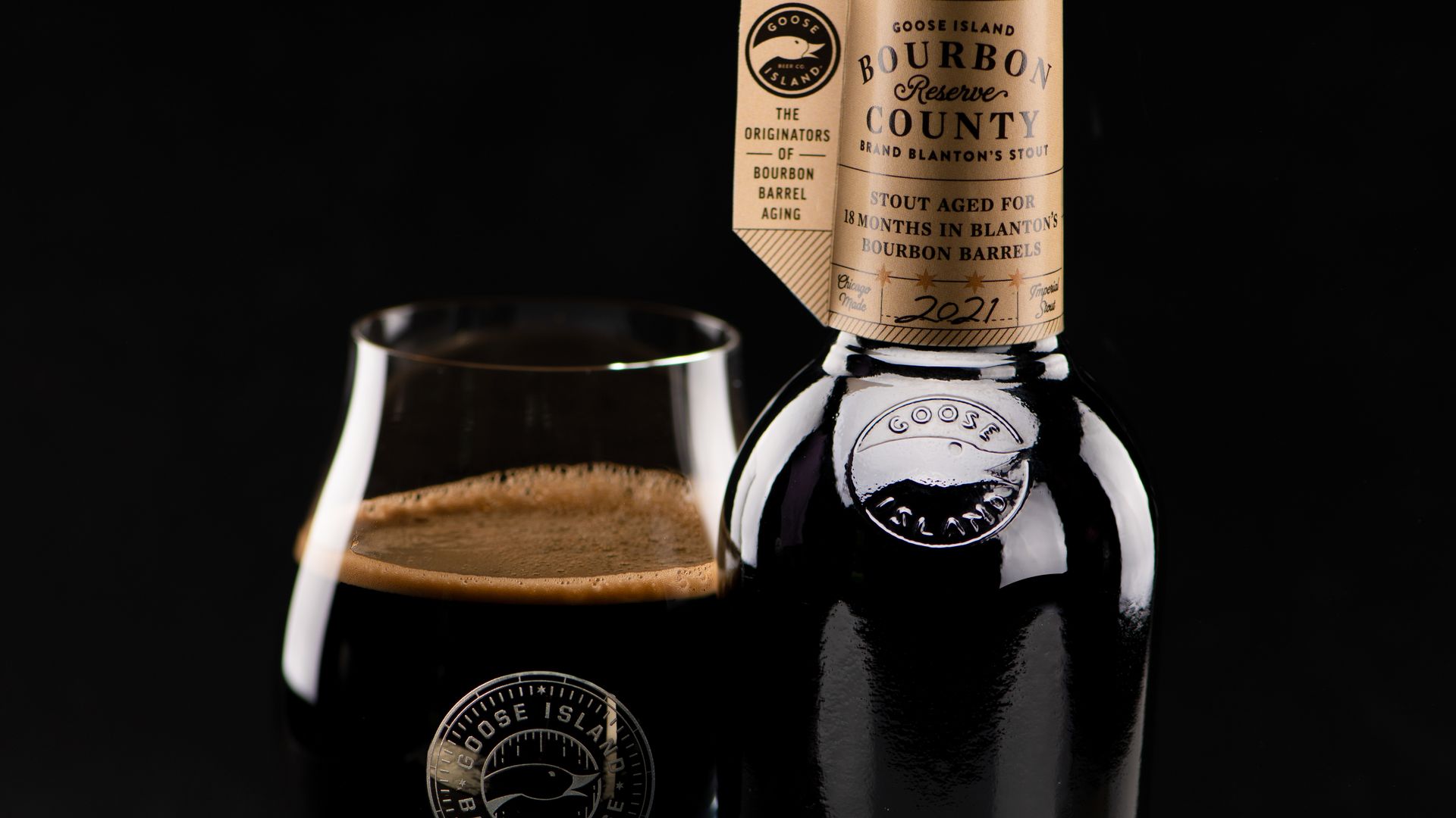 A Bourbon County beer in a glass and bottle