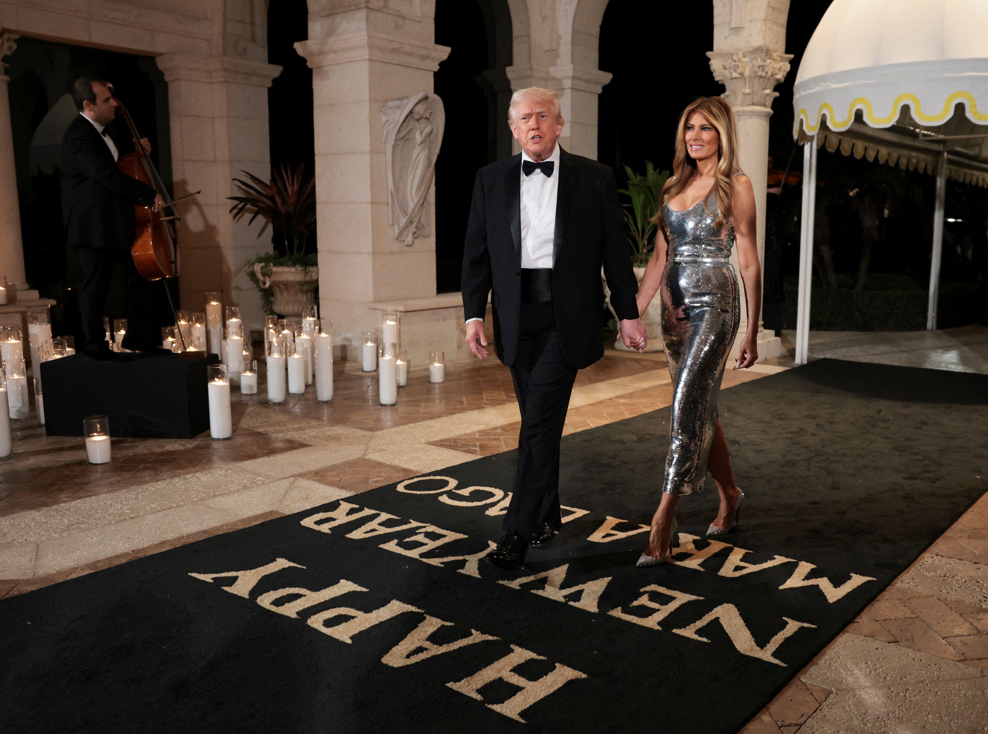 President Trump and First Lady Melania Trump arrive at Mar-a-Lago's New Year's Eve party. Photo: Jonathan Ernst/Reuters