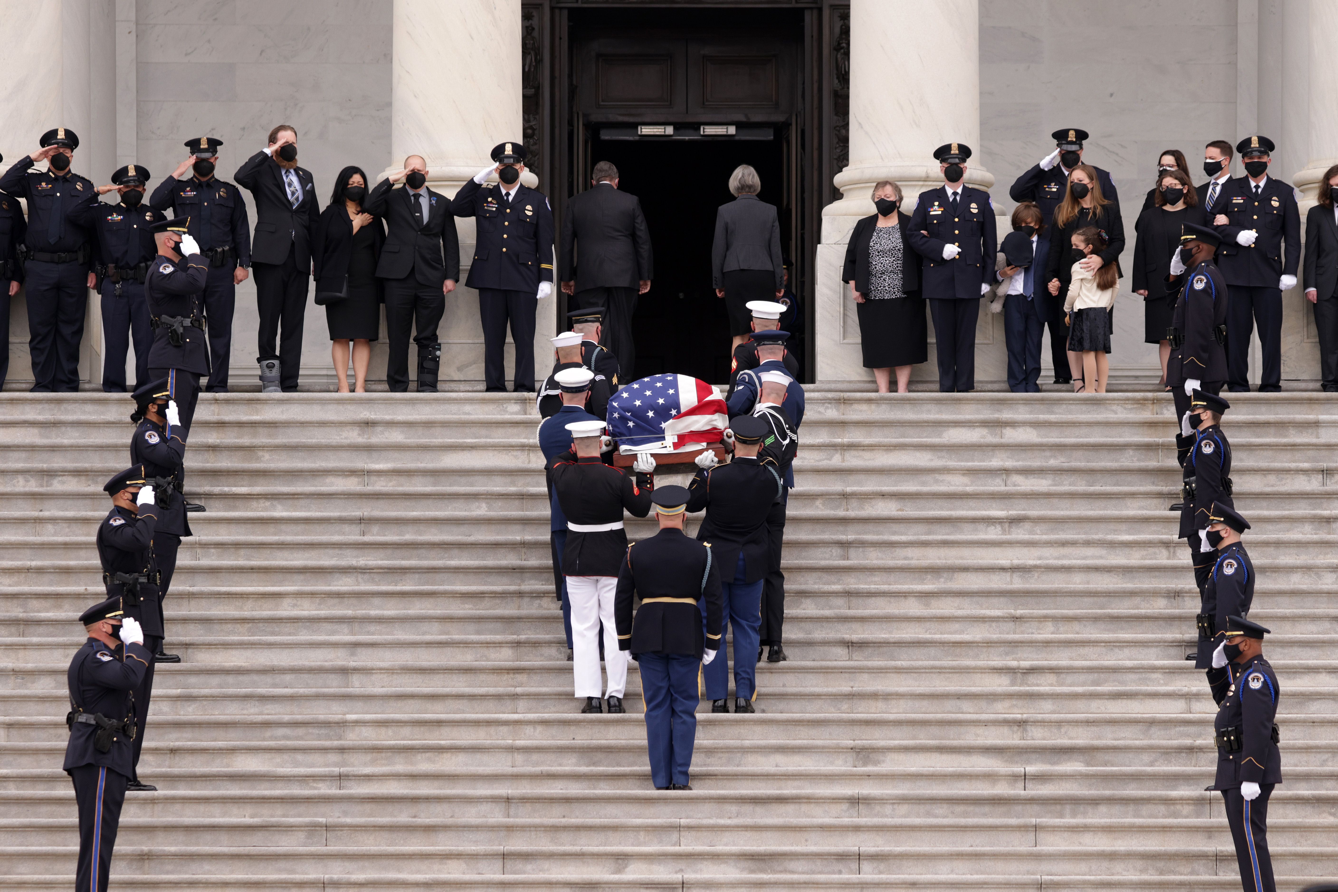 Evans' casket being carried up the Capitol steps. Photo: Alex Wong/Getty Images