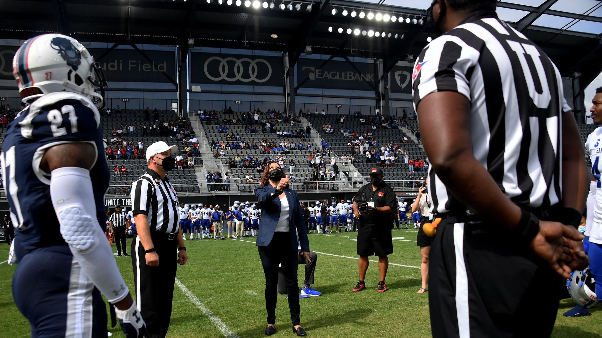 Vice President Kamala Harris tosses the coin for the football game between Howard University and Hampton University at Audi Field in Washington, DC, on September 18, 2021.